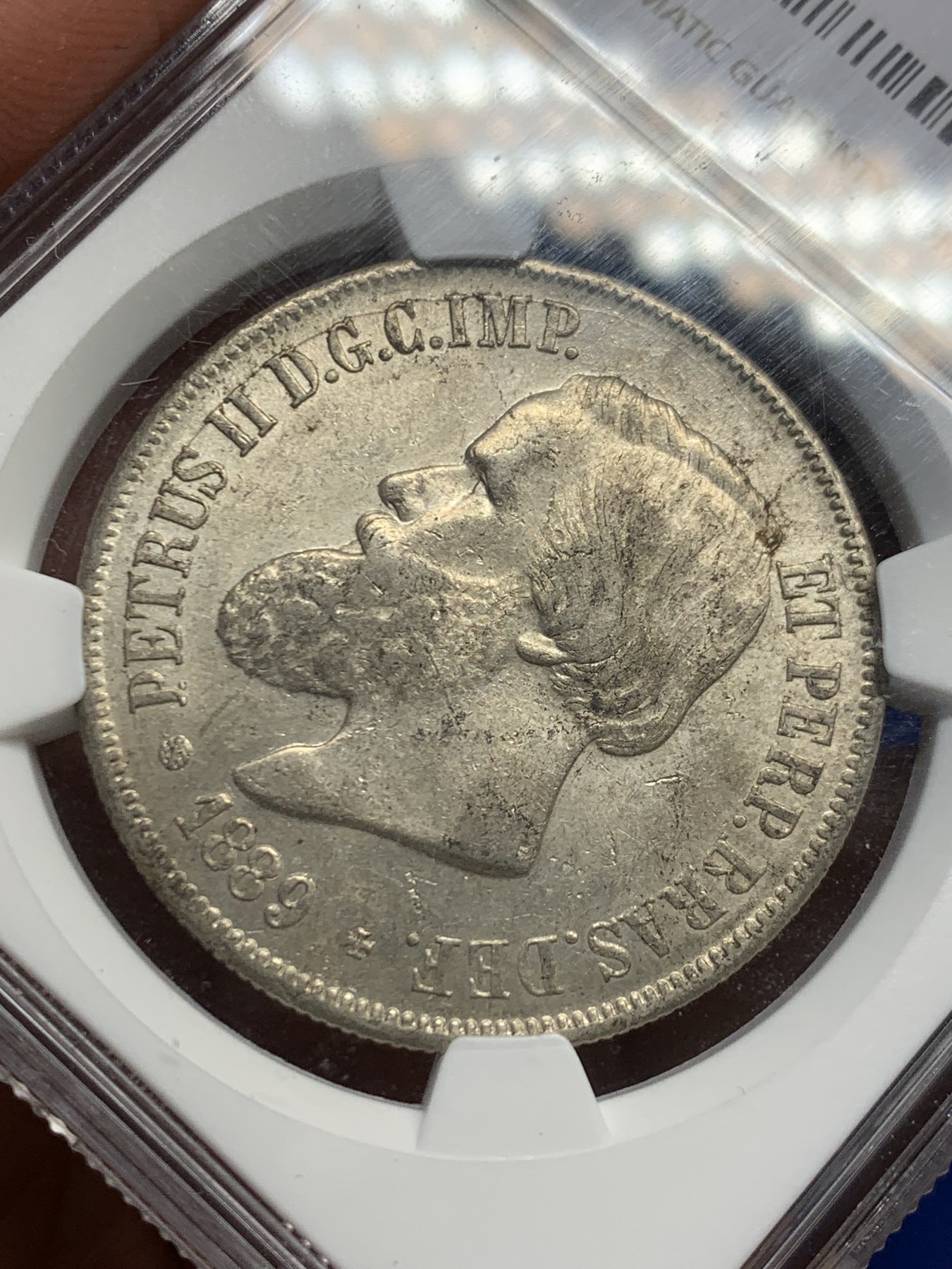 《竞宝斋》第244场-周日，周一 新年开场 (全场包邮) NGC AU58 巴西帝国1889年佩德罗二世2000瑞斯银币，原味老包浆，底板带光，值得收藏。