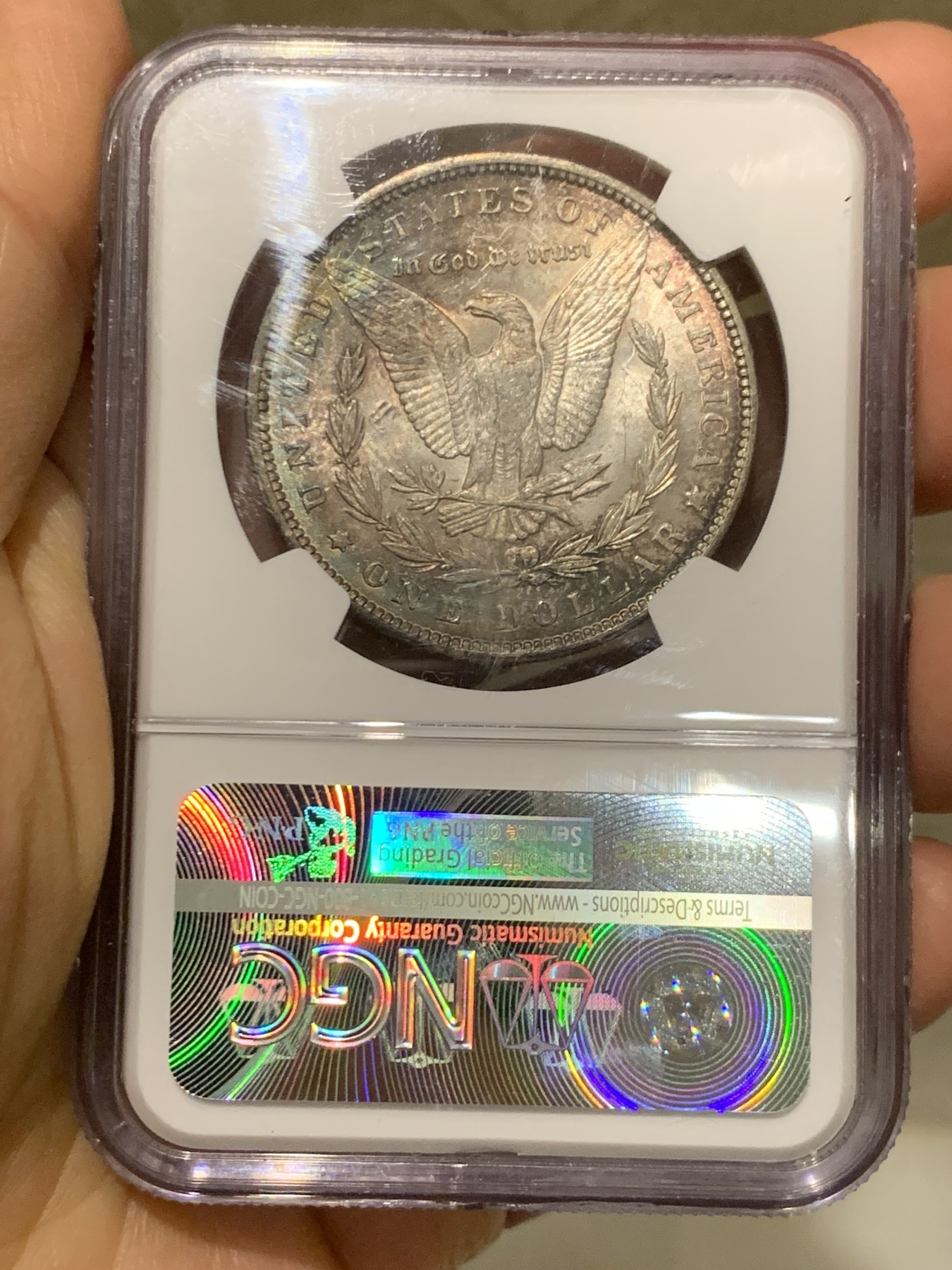 《竞宝斋》第244场-周日，周一 新年开场 (全场包邮) NGC MS63 美国1888年摩根银币，原汁原味双面环五彩包浆，状态难得。状态低评。好年份1888吉祥寓意要发发发，市场上比较稀少年份版本的摩根币。