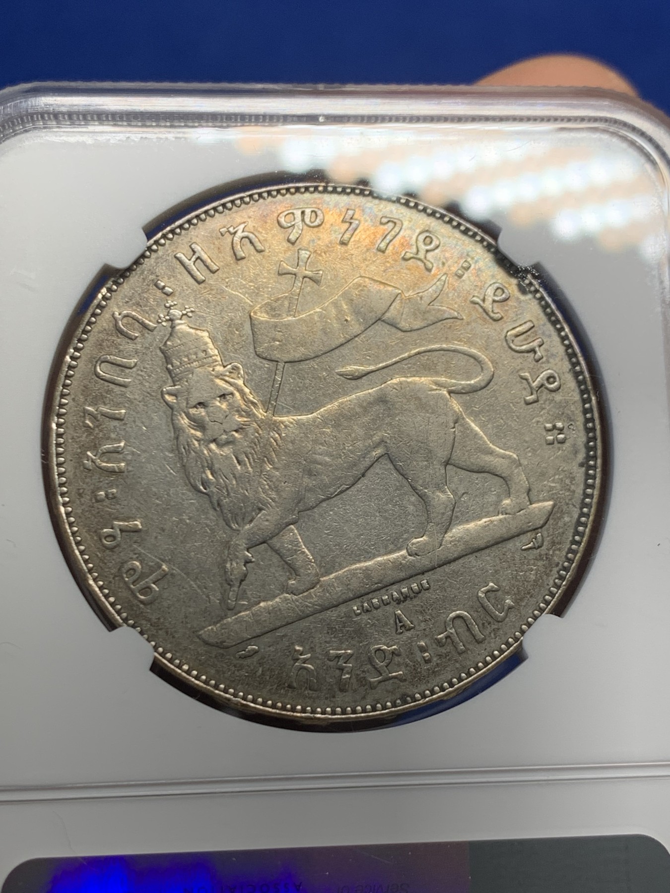 《竞宝斋》第244场-周日，周一 新年开场 (全场包邮) NGC AU 埃塞俄比亚1887狮子扛旗1比尔大银币 经典品种 雄狮左抗旗 细节不错 无明显磕划损坏 此前AU Damage竞宝斋1300元不含佣成交