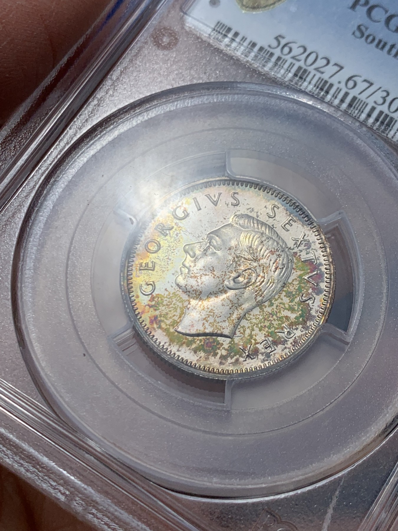 《竞宝斋》第244场-周日，周一 新年开场 (全场包邮) PCGS PR67 英属南非1951年1先令精制银币 稳亚军分 罕见超高分毕业收藏级 极美五彩包浆 盒子有损