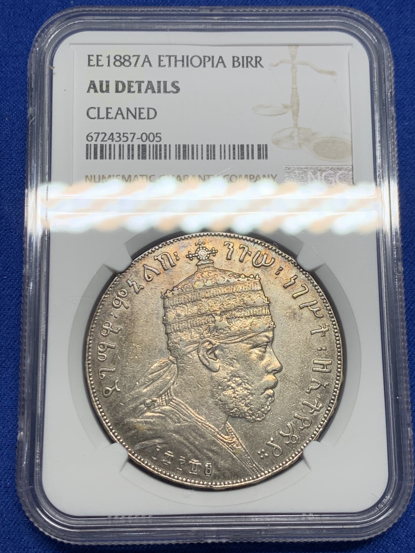 《竞宝斋》第244场-周日，周一 新年开场 (全场包邮) NGC AU 埃塞俄比亚1887狮子扛旗1比尔大银币 经典品种 雄狮左抗旗 细节不错 无明显磕划损坏 此前AU Damage竞宝斋1300元不含佣成交