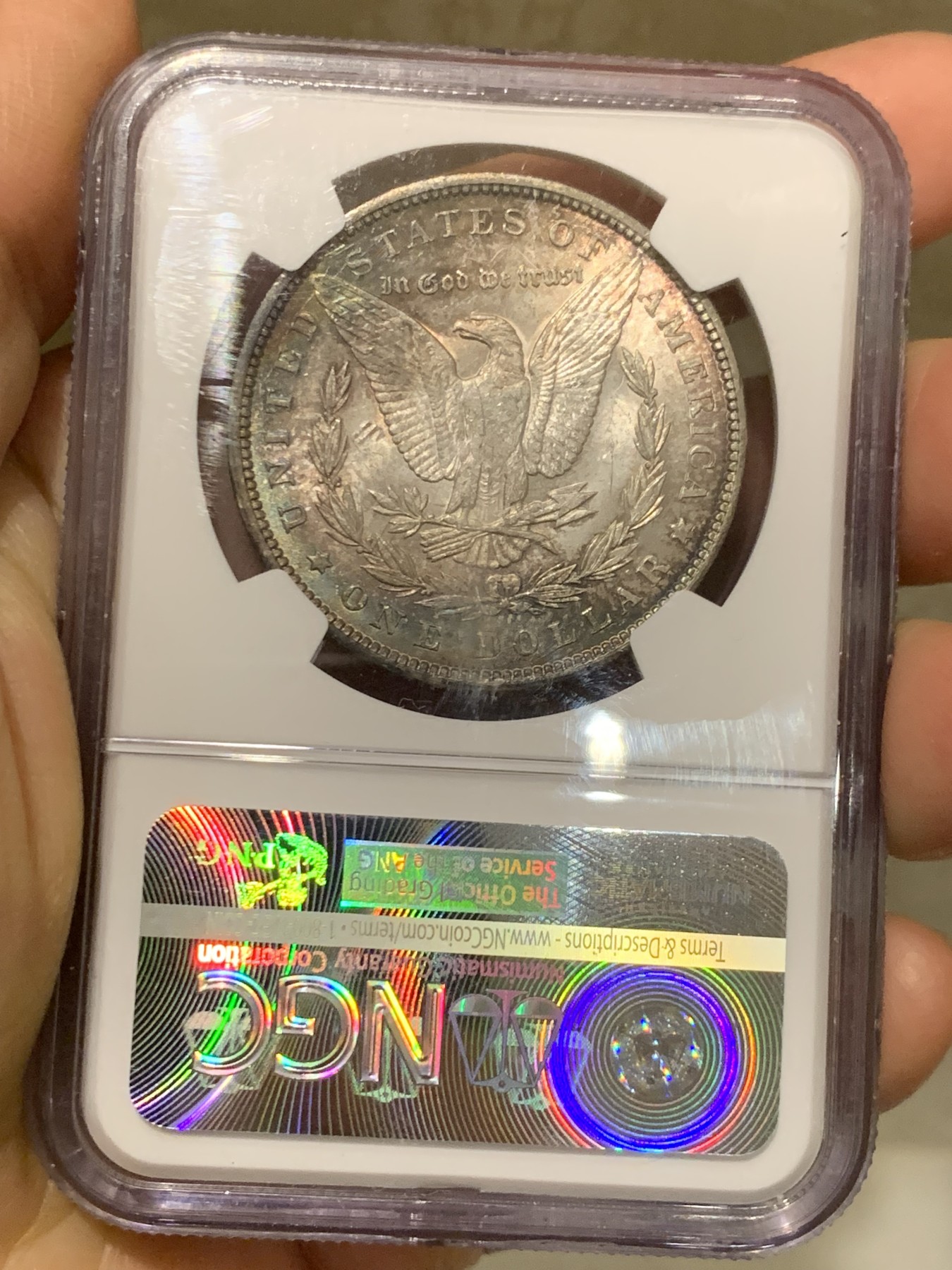 《竞宝斋》第244场-周日，周一 新年开场 (全场包邮) NGC MS63 美国1888年摩根银币，原汁原味双面环五彩包浆，状态难得。状态低评。好年份1888吉祥寓意要发发发，市场上比较稀少年份版本的摩根币。