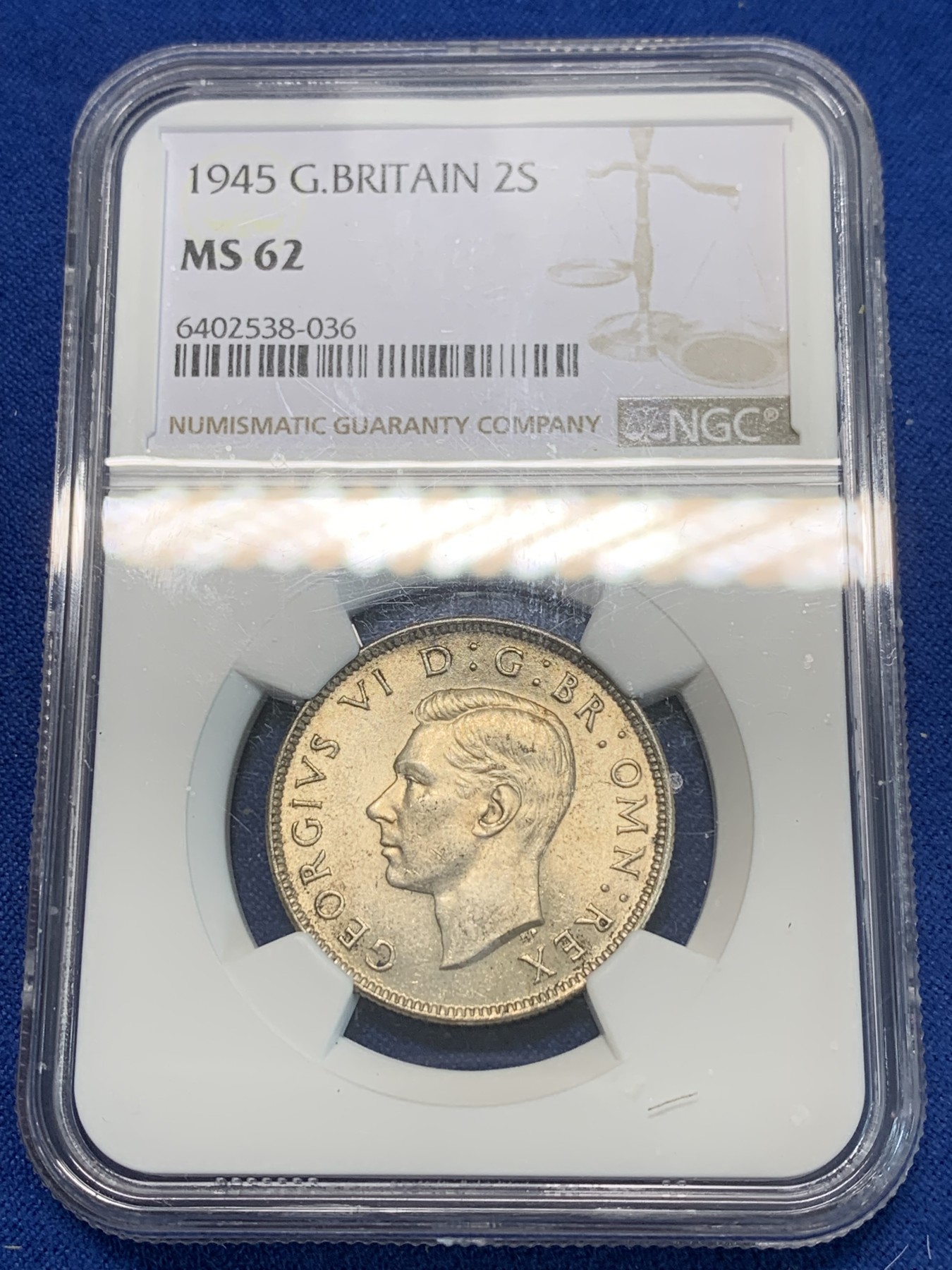 《竞宝斋》第244场-周日，周一 新年开场 (全场包邮) NGC MS62 英国1945年乔治六世2先令银币 原光五彩 状态一流