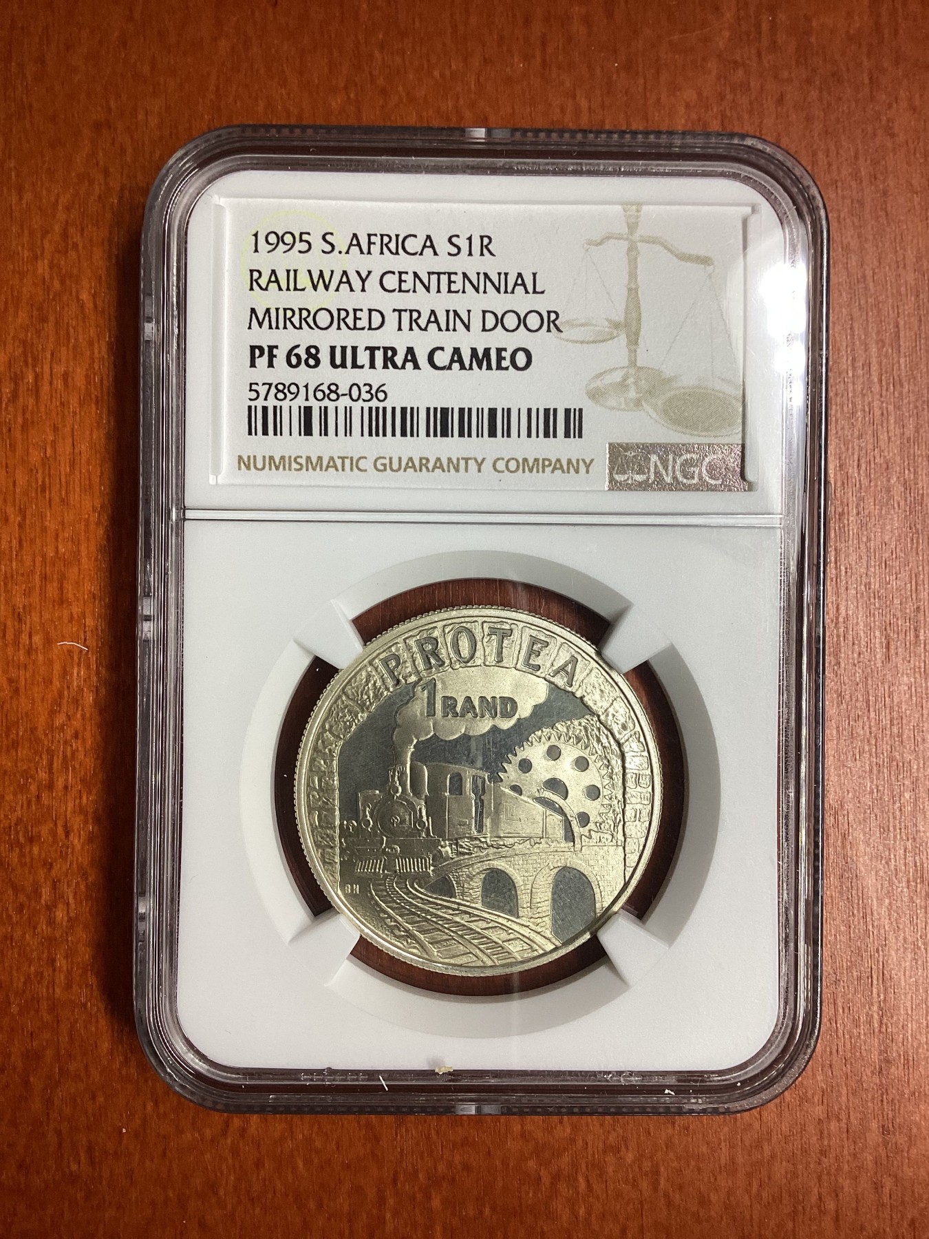 长老汇龙年精选第二场 1995 南非火车百年1朗德精制银币，NGC PF68UC，发行量4491枚