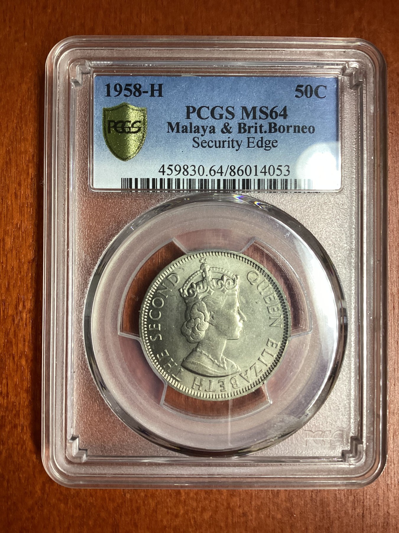 长老汇龙年精选第二场 1958-H 马来西亚和英属婆罗洲伊丽莎白二世50分铜镍币，PCGS MS64分，更高分仅有13枚，安全边