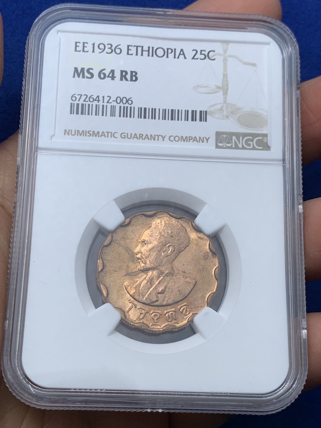 《竞宝斋》第245场-周日，周一 ，周二3场连拍 (全场包邮) NGC MS64RB 埃塞俄比亚1936年25分 经典独特的花瓣型搭配狮子扛旗 威武霸气 这个品种原铜色好品相不多的