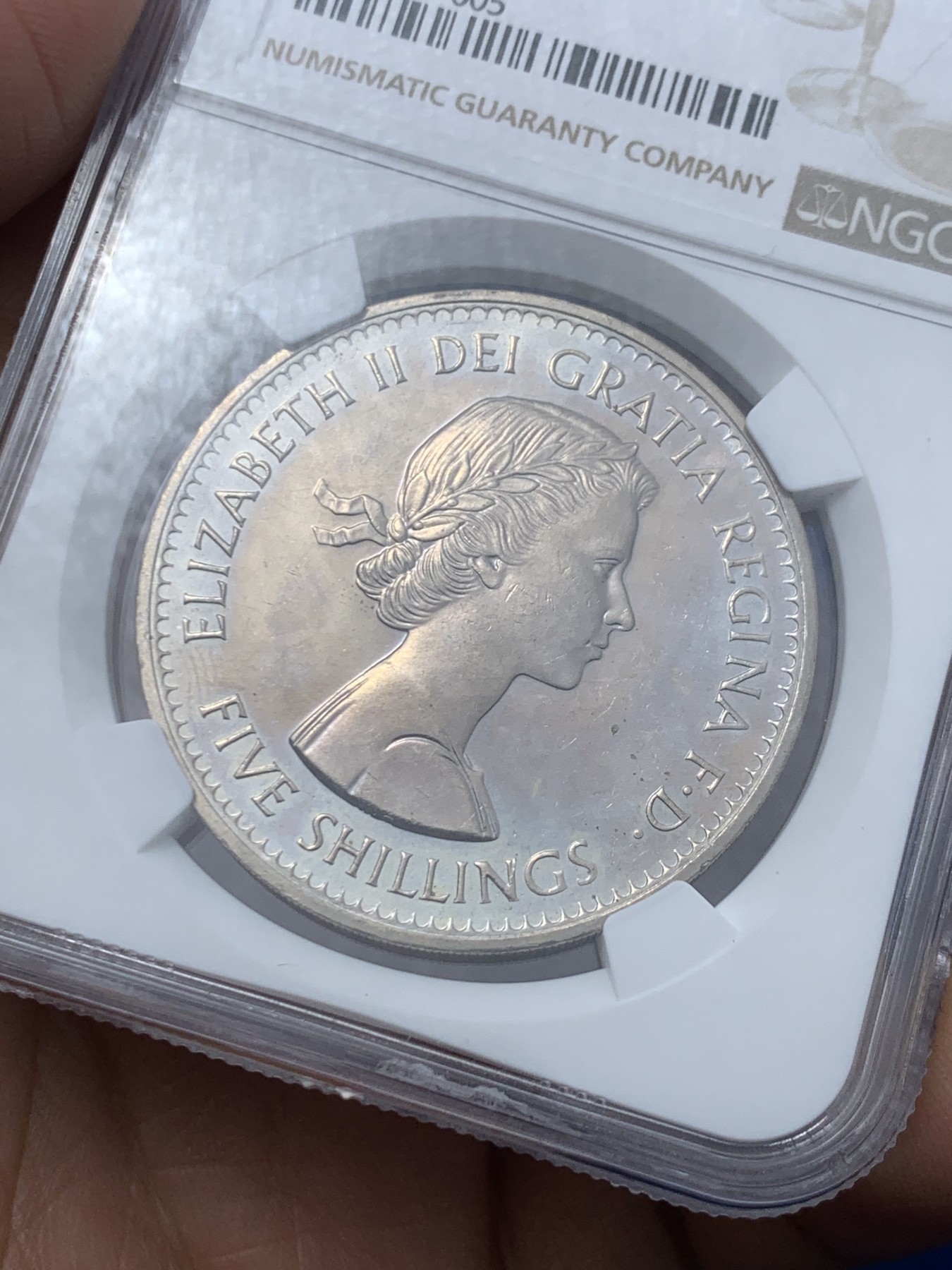 《竞宝斋》第245场-周日，周一 ，周二3场连拍 (全场包邮) NGC-PL64 英国  1960年 1克朗 大英纽约博览会纪念5先令 铜镍币 （稀少类精制版本，发行量仅7万，伊丽莎白二世女王少女头像，最后的克朗币）