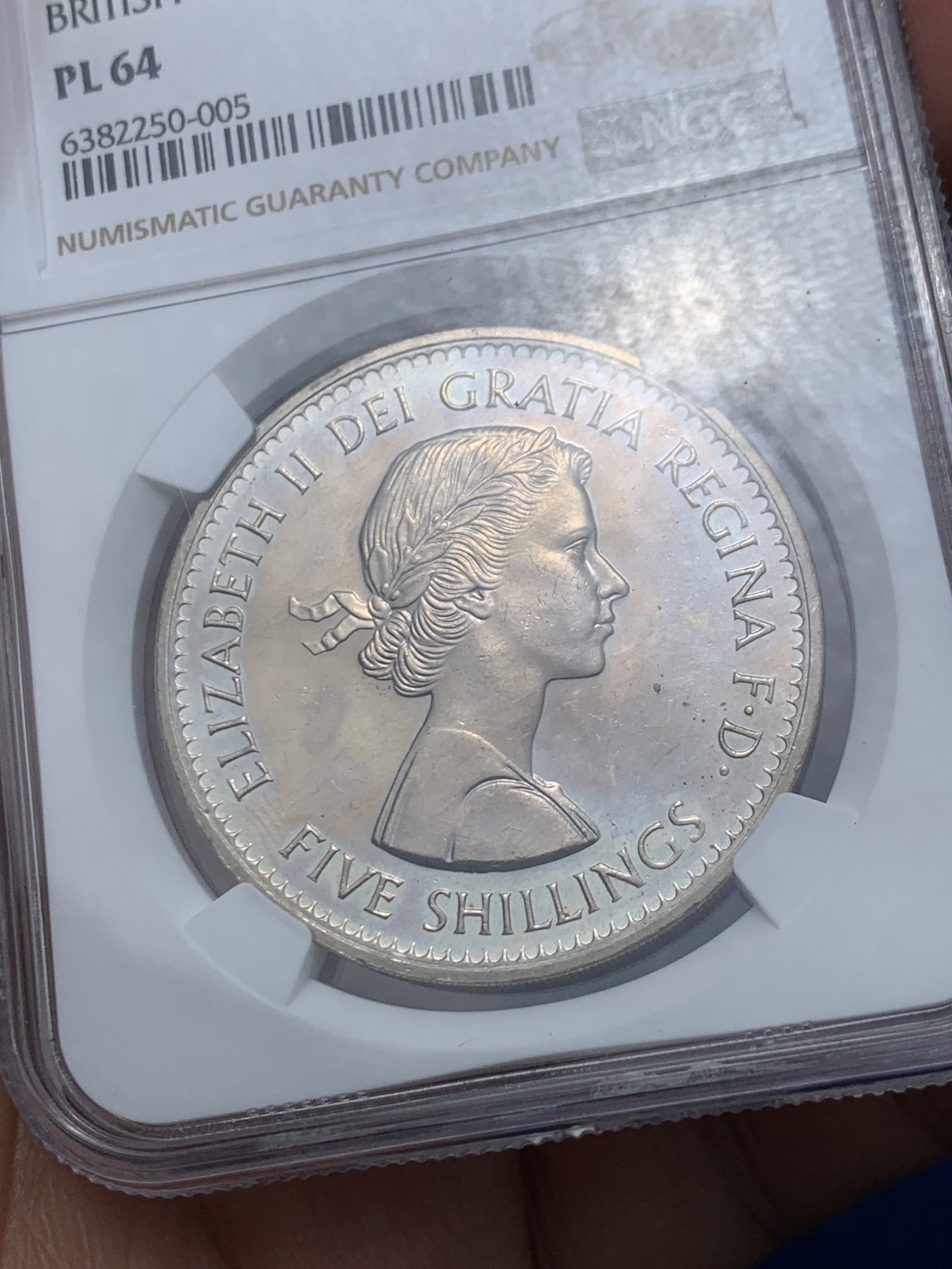 《竞宝斋》第245场-周日，周一 ，周二3场连拍 (全场包邮) NGC-PL64 英国  1960年 1克朗 大英纽约博览会纪念5先令 铜镍币 （稀少类精制版本，发行量仅7万，伊丽莎白二世女王少女头像，最后的克朗币）