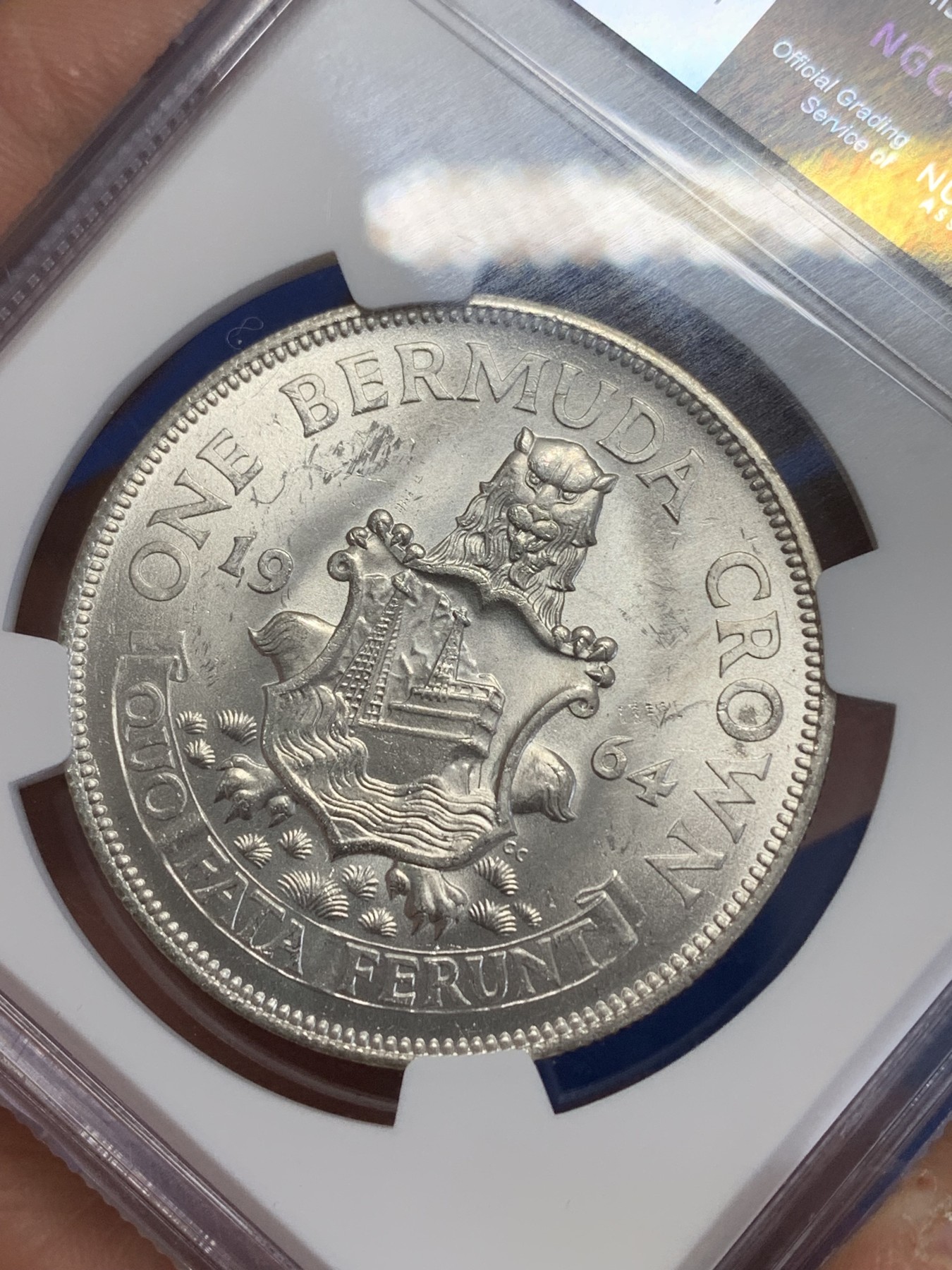 《竞宝斋》第245场-周日，周一 ，周二3场连拍 (全场包邮) NGC-MS64 英属百慕大群岛1964年伊丽莎白二世1克朗纪念银币，车轮转光，状态佳。