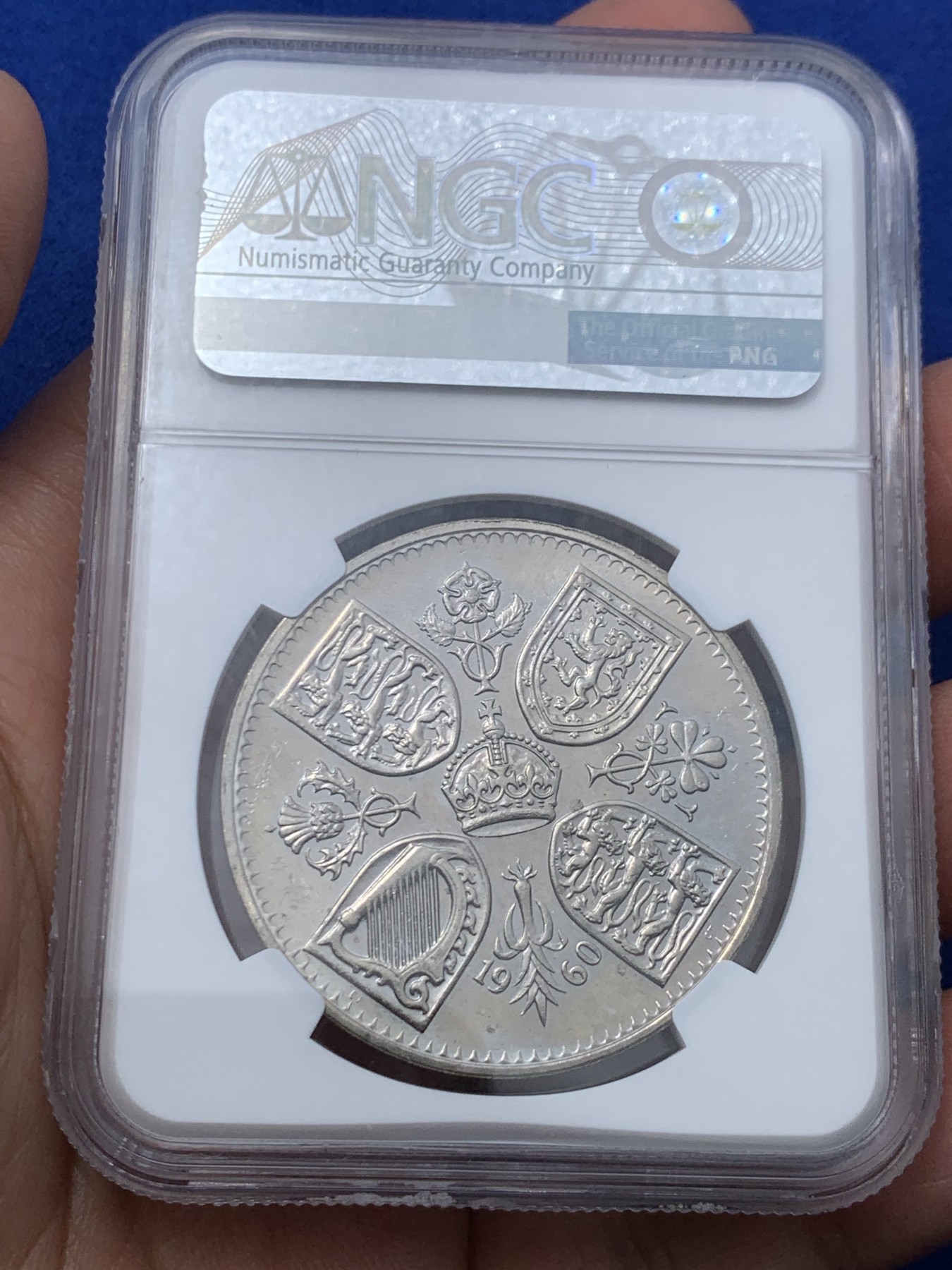 《竞宝斋》第245场-周日，周一 ，周二3场连拍 (全场包邮) NGC-PL64 英国  1960年 1克朗 大英纽约博览会纪念5先令 铜镍币 （稀少类精制版本，发行量仅7万，伊丽莎白二世女王少女头像，最后的克朗币）