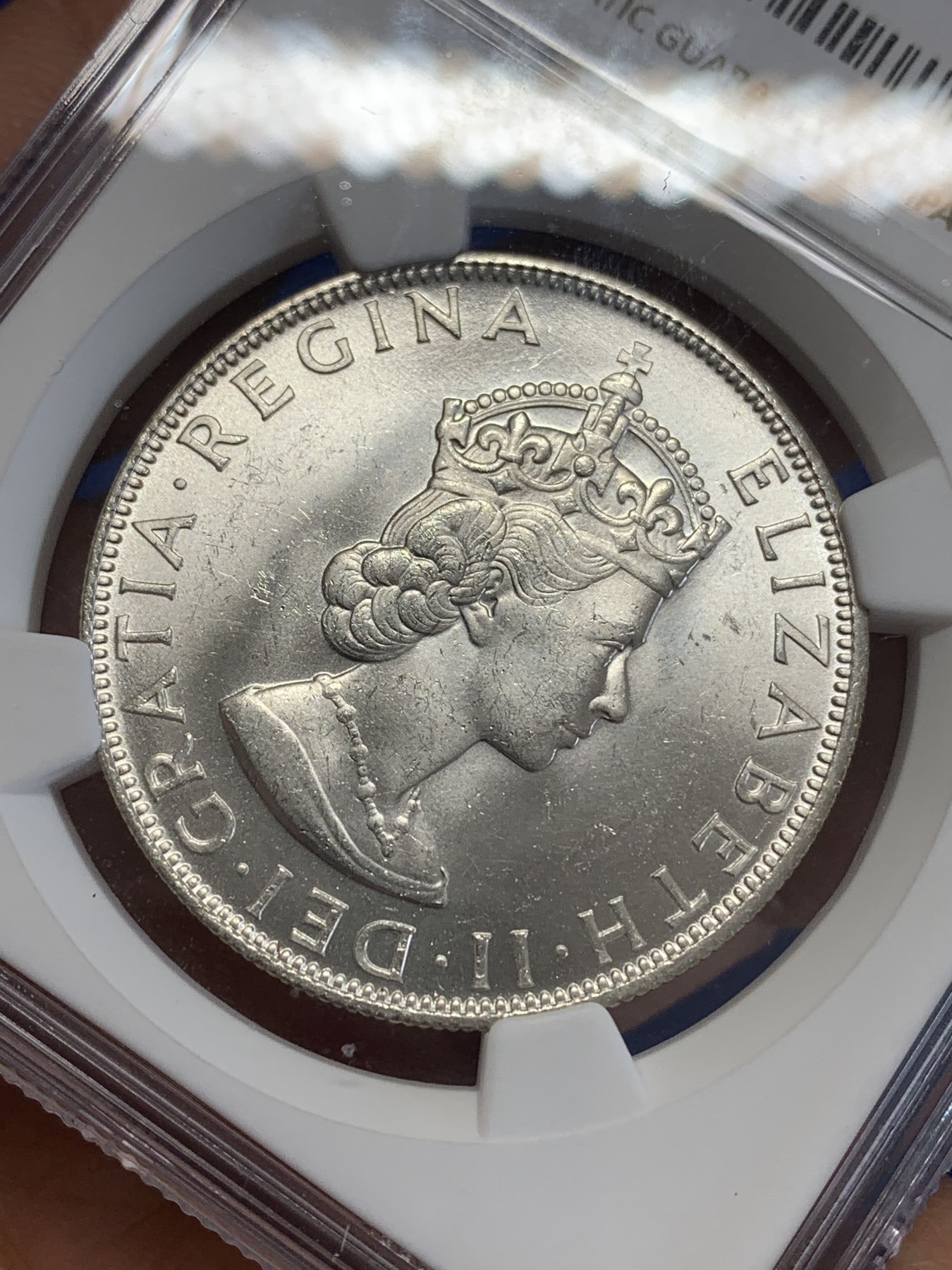 《竞宝斋》第245场-周日，周一 ，周二3场连拍 (全场包邮) NGC-MS64 英属百慕大群岛1964年伊丽莎白二世1克朗纪念银币，车轮转光，状态佳。