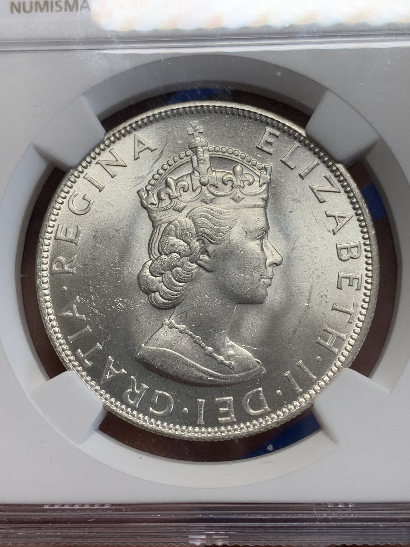 《竞宝斋》第245场-周日，周一 ，周二3场连拍 (全场包邮) NGC-MS64 英属百慕大群岛1964年伊丽莎白二世1克朗纪念银币，车轮转光，状态佳。