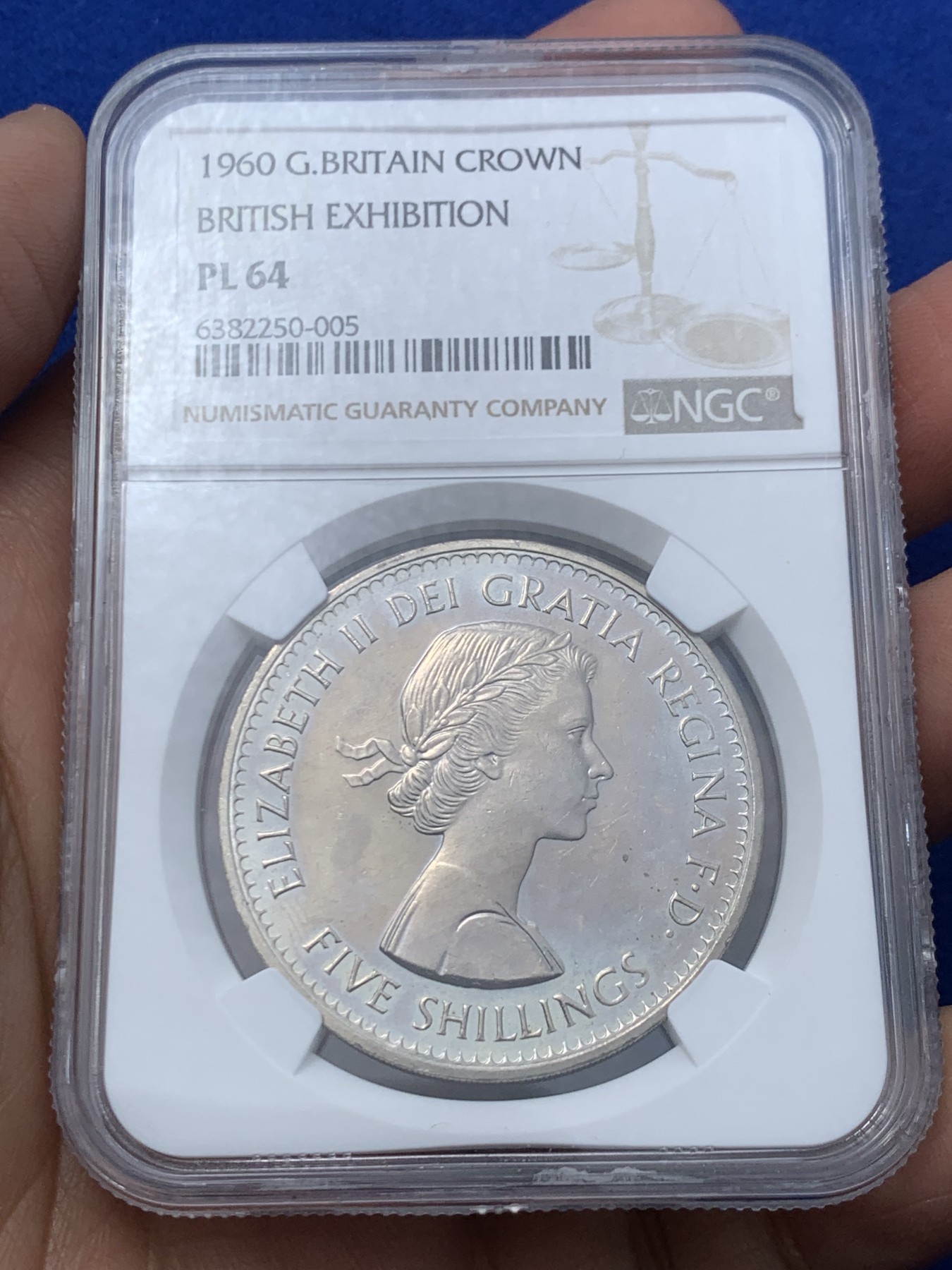 《竞宝斋》第245场-周日，周一 ，周二3场连拍 (全场包邮) NGC-PL64 英国  1960年 1克朗 大英纽约博览会纪念5先令 铜镍币 （稀少类精制版本，发行量仅7万，伊丽莎白二世女王少女头像，最后的克朗币）