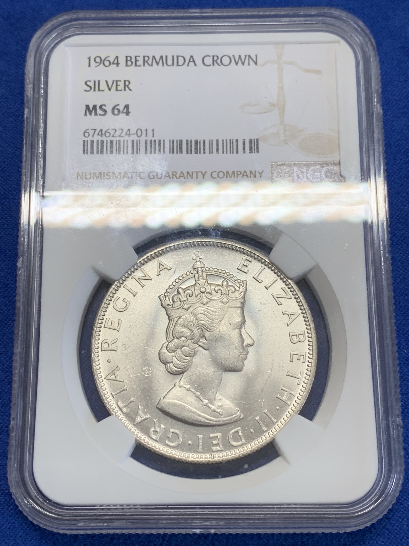 《竞宝斋》第245场-周日，周一 ，周二3场连拍 (全场包邮) NGC-MS64 英属百慕大群岛1964年伊丽莎白二世1克朗纪念银币，车轮转光，状态佳。