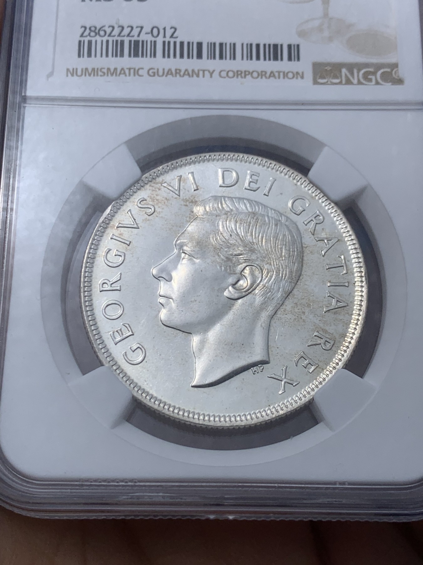 《竞宝斋》第246场-周日，周一 ，周二3场连拍 (全场包邮) NGC-MS65 加拿大1949年乔治六世帆船壹圆大银币，底板pl感十足，丝滑车轮光，无暇状态，老号段严评。