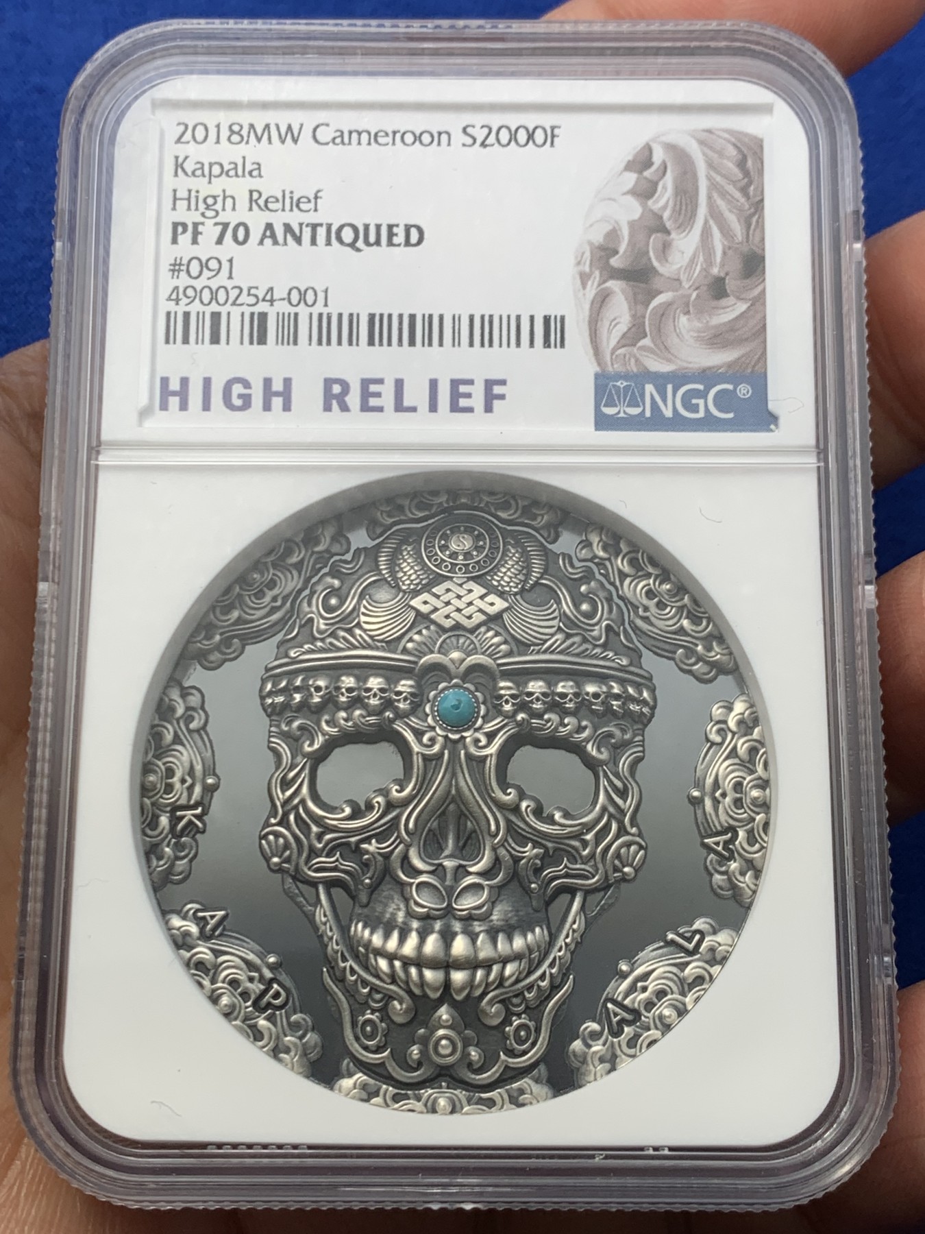 《竞宝斋》第246场-周日，周一 ，周二3场连拍 (全场包邮) NGC PF70 喀麦隆2018卡帕拉头盖镶嵌绿松石 2盎司 银币 091 高浮雕标 盒证齐全 镶嵌工艺 世界文化系列首枚 状态极好