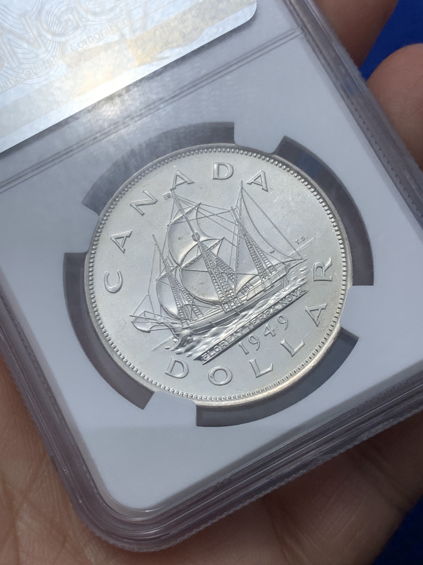 《竞宝斋》第246场-周日，周一 ，周二3场连拍 (全场包邮) NGC-MS65 加拿大1949年乔治六世帆船壹圆大银币，底板pl感十足，丝滑车轮光，无暇状态，老号段严评。