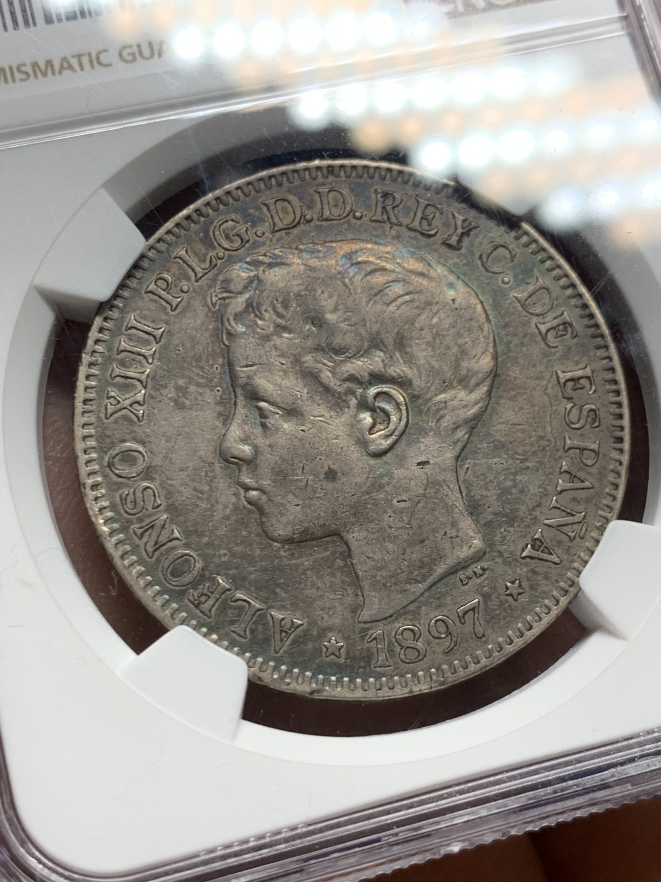 《竞宝斋》第246场-周日，周一 ，周二3场连拍 (全场包邮) NGC XF45 1897年西属菲律宾1比索 五彩包浆，仅发行一年的西属菲律宾唯一大银，HA上成交价300多美元