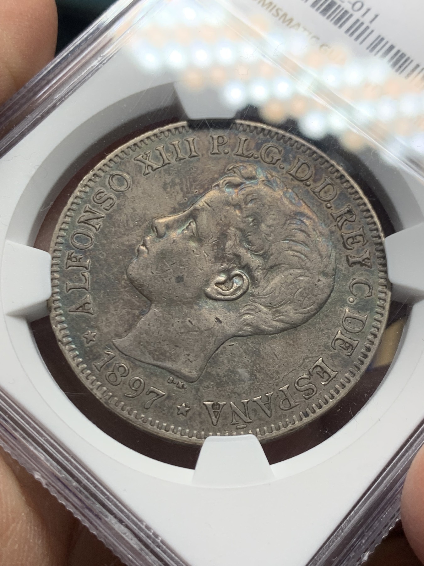 《竞宝斋》第246场-周日，周一 ，周二3场连拍 (全场包邮) NGC XF45 1897年西属菲律宾1比索 五彩包浆，仅发行一年的西属菲律宾唯一大银，HA上成交价300多美元