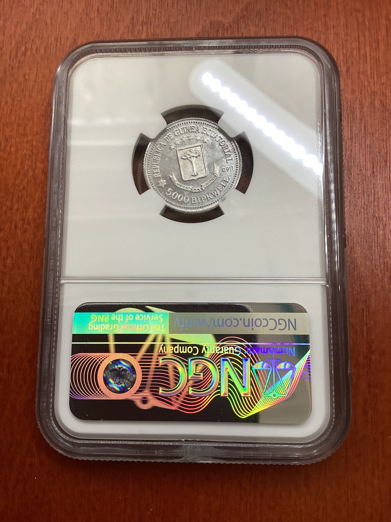 长老汇龙年精选第三场 1979赤道几内亚西班牙卡洛斯一世访问5000B铝制样币，NGC MS64分，N盒唯一记录，发行量大约20枚左右
