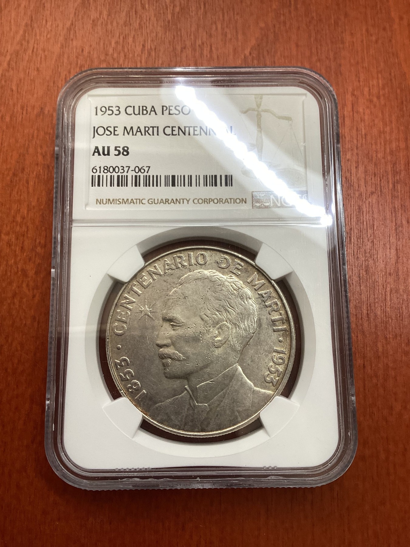 长老汇龙年精选第三场 1953 古巴何塞·马丁百周年1比索大银币，NGC AU58分