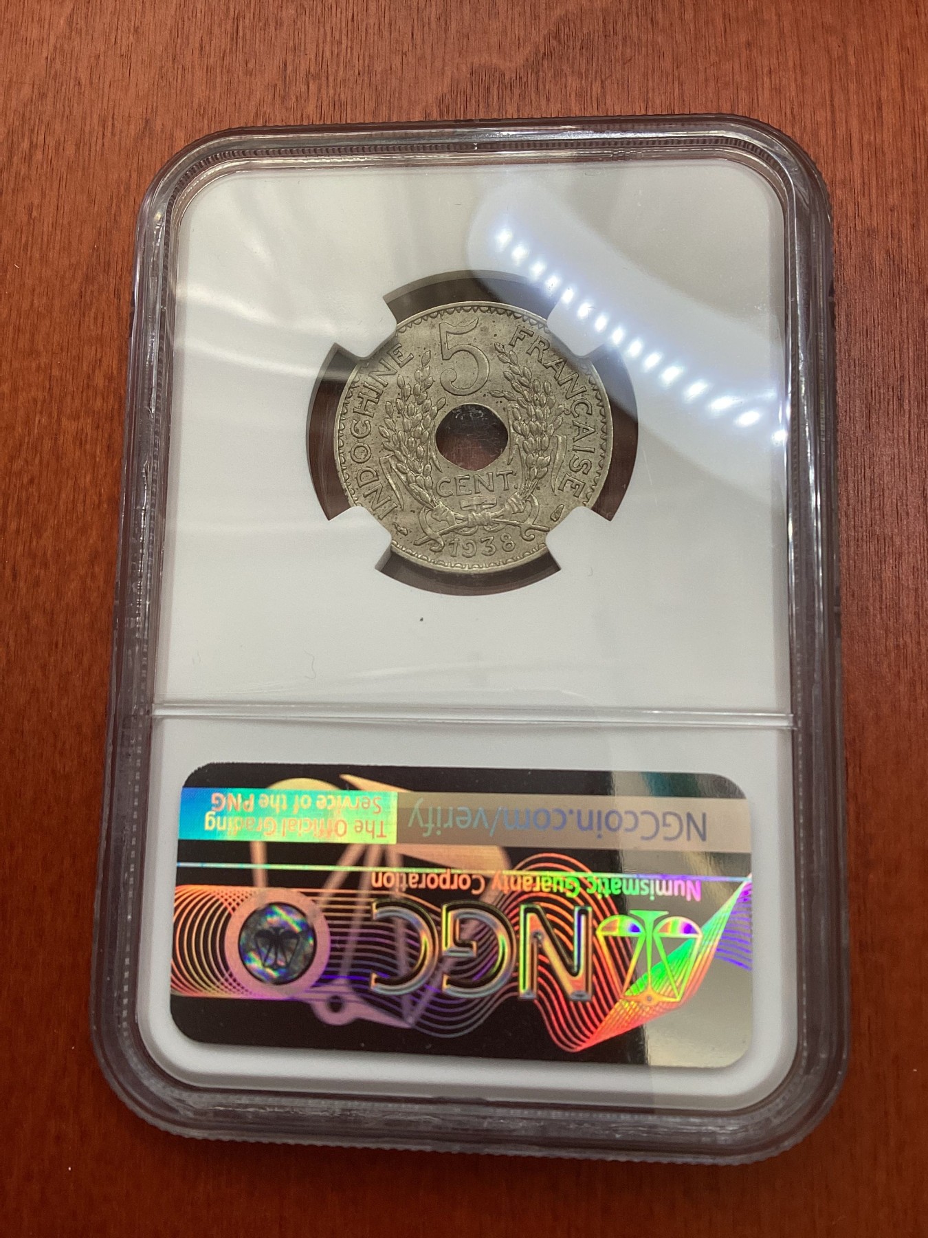 长老汇龙年精选第三场 1938 法属印度支那5分中孔铜镍币，NGC MS63分