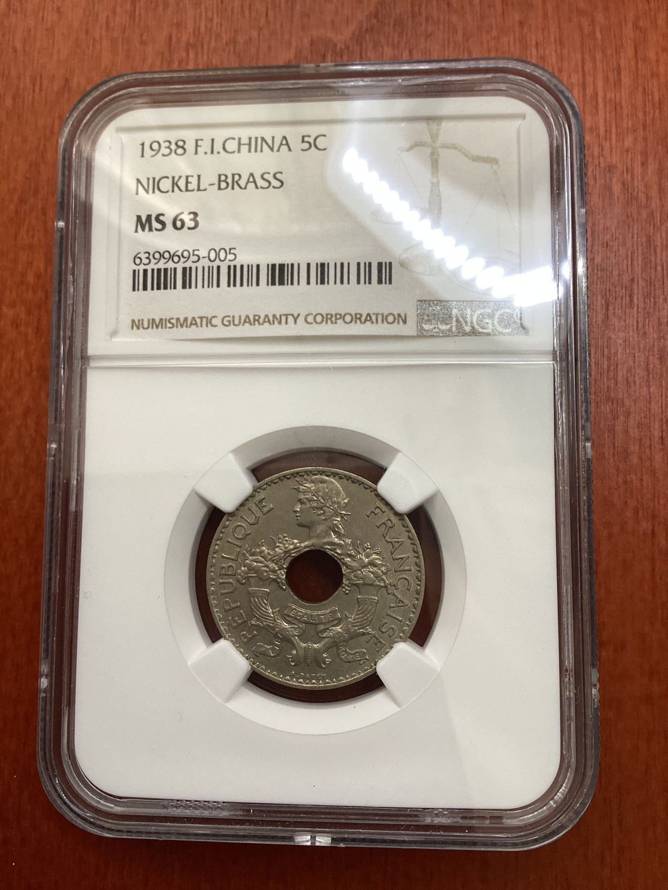 长老汇龙年精选第三场 1938 法属印度支那5分中孔铜镍币，NGC MS63分