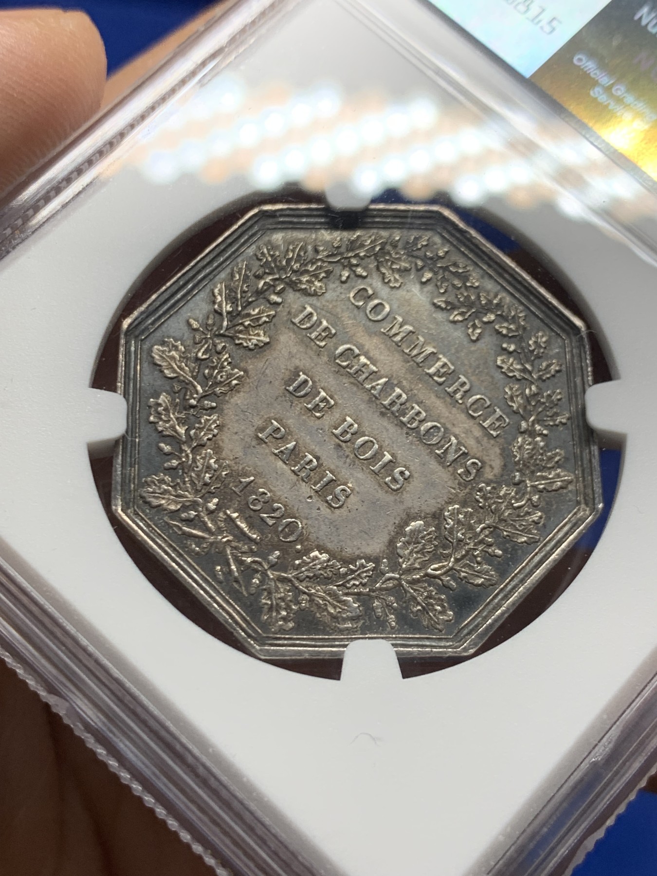 《竞宝斋》第250场-周日，周一 ，周二3场连拍 (全场包邮) NGC-AU58 法国名誉品巴黎煤炭贸易公司八角代用银币，此款难点在背面底板，已属不易