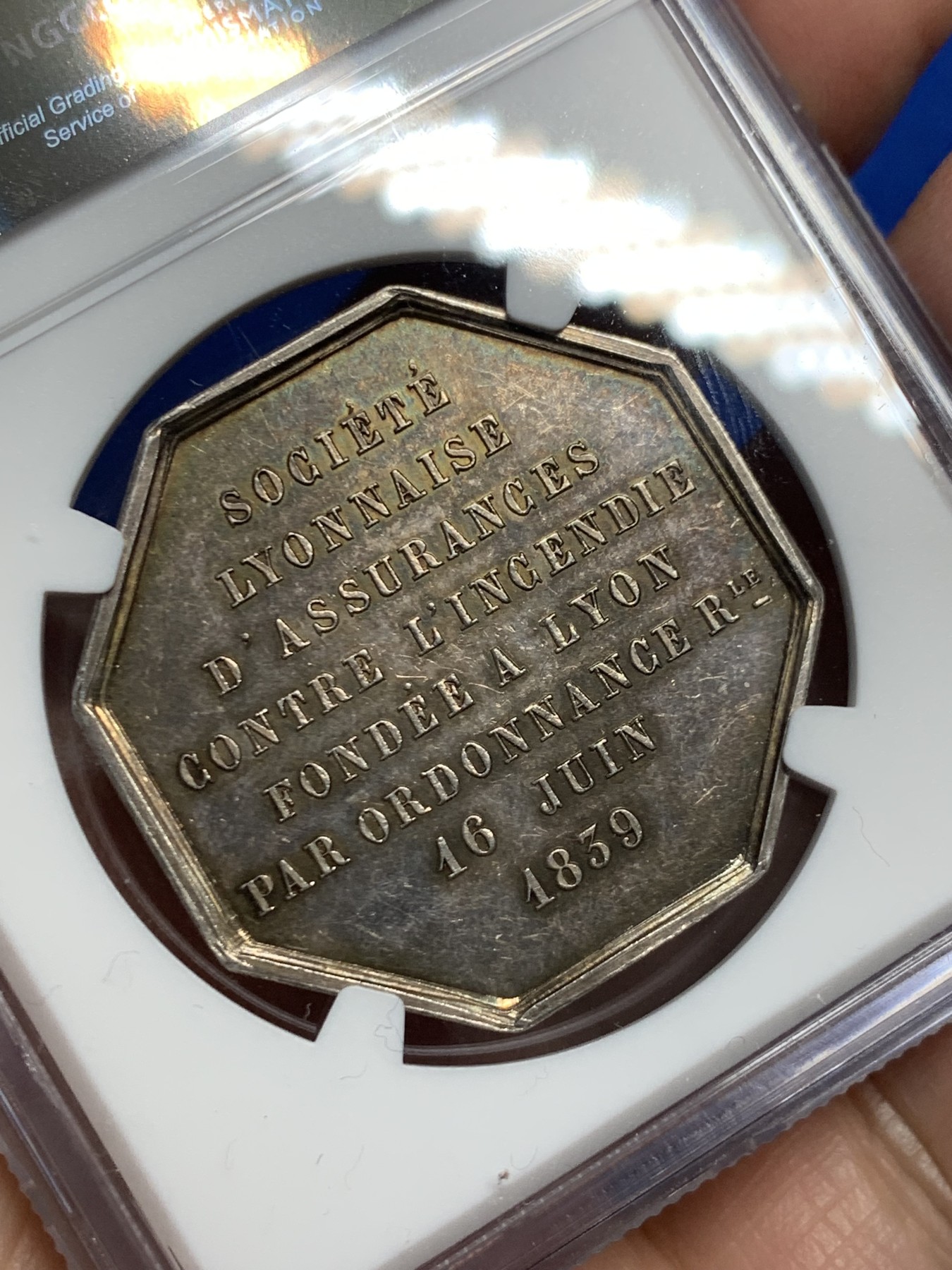 《竞宝斋》第250场-周日，周一 ，周二3场连拍 (全场包邮) NGC MS62 法国1839里昂保险八角银质代币 手指边铭