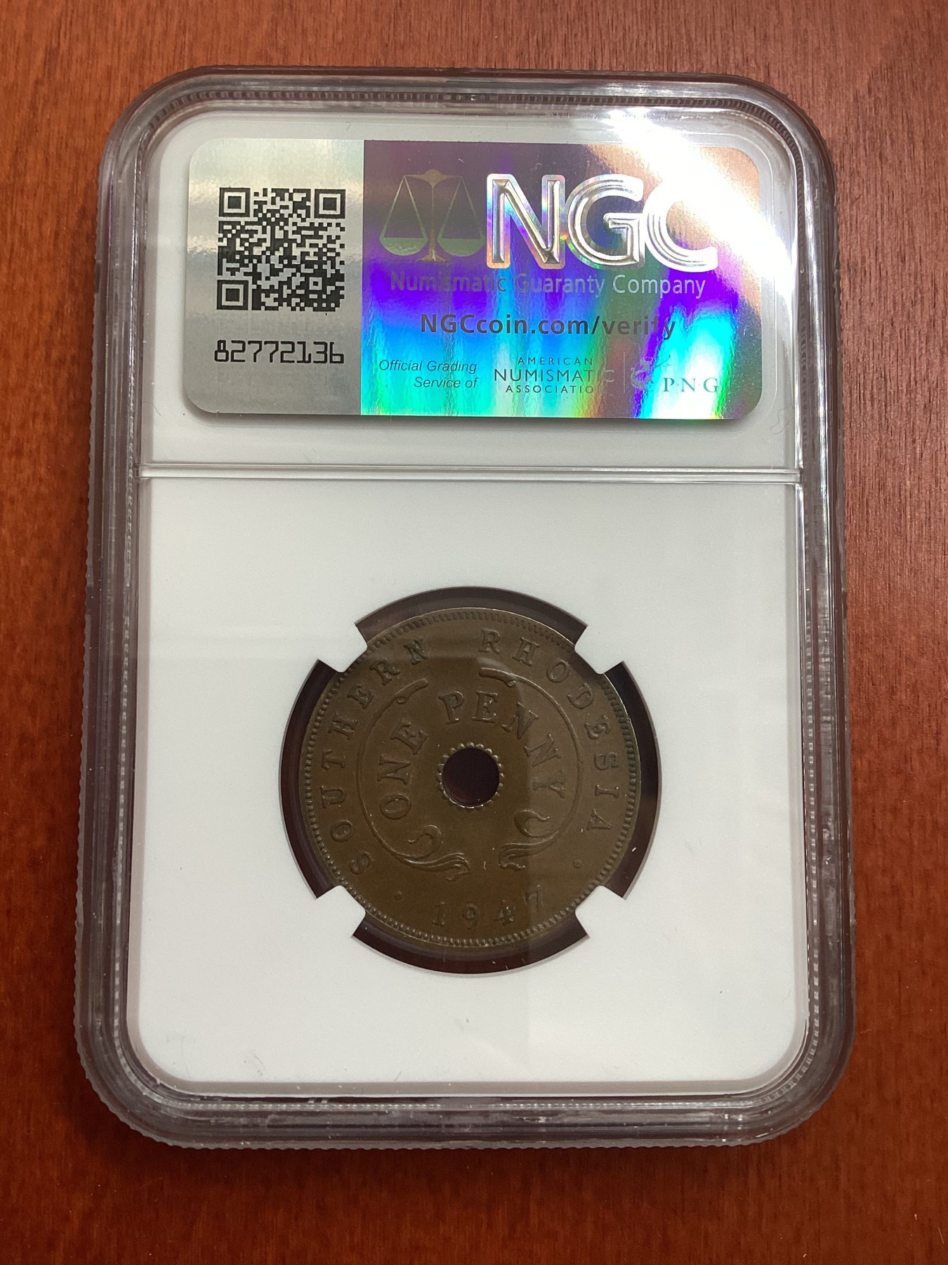 长老汇龙年精选第三场 1947南罗德西亚1便士中孔铜币，NGC AU58BN，更高分仅有7枚