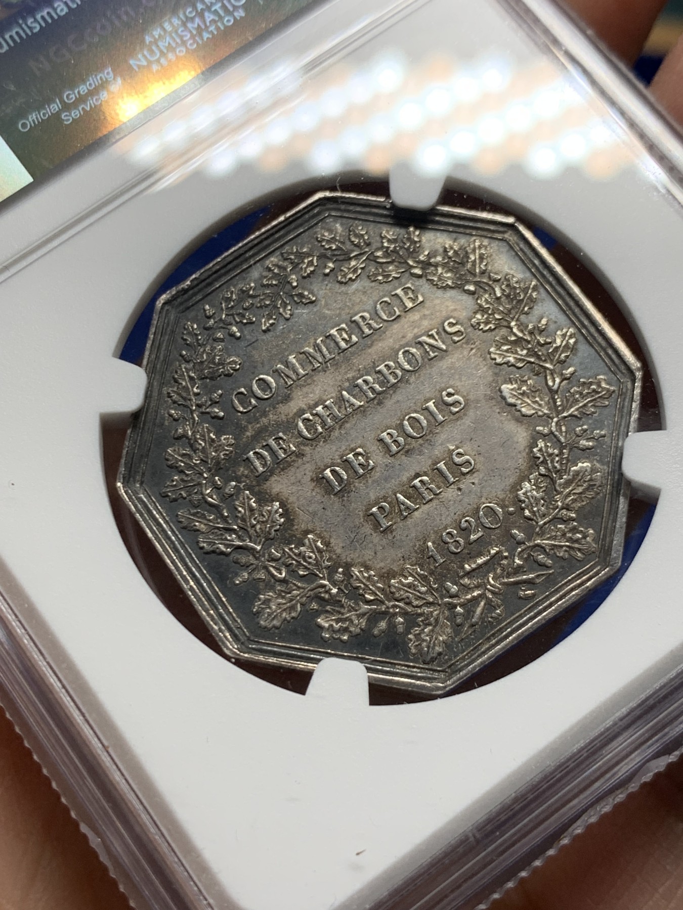 《竞宝斋》第250场-周日，周一 ，周二3场连拍 (全场包邮) NGC-AU58 法国名誉品巴黎煤炭贸易公司八角代用银币，此款难点在背面底板，已属不易