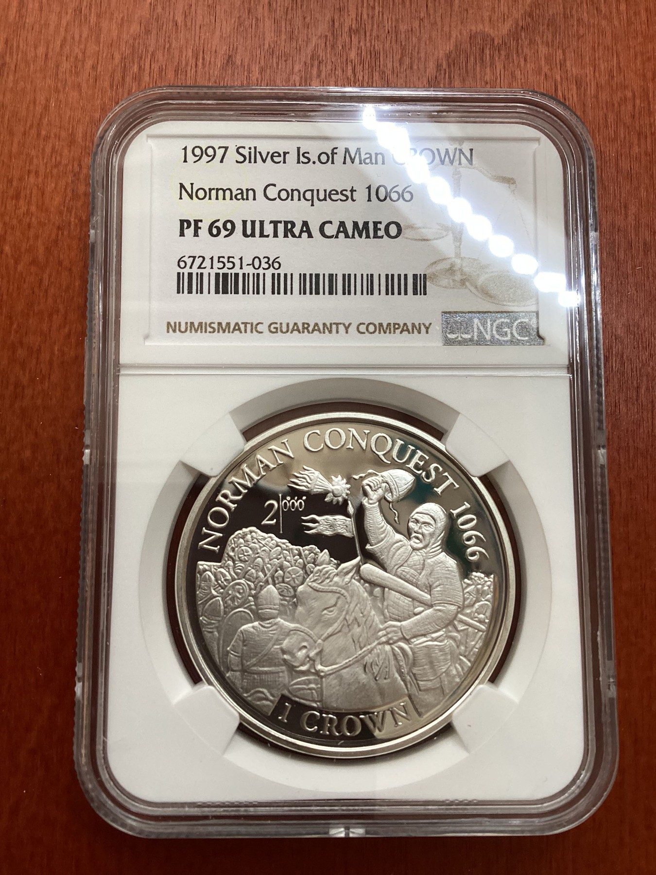 长老汇龙年精选第三场 1997 马恩1066年诺曼底征服1克朗精制银币，NGC PF69UC，唯一冠军分