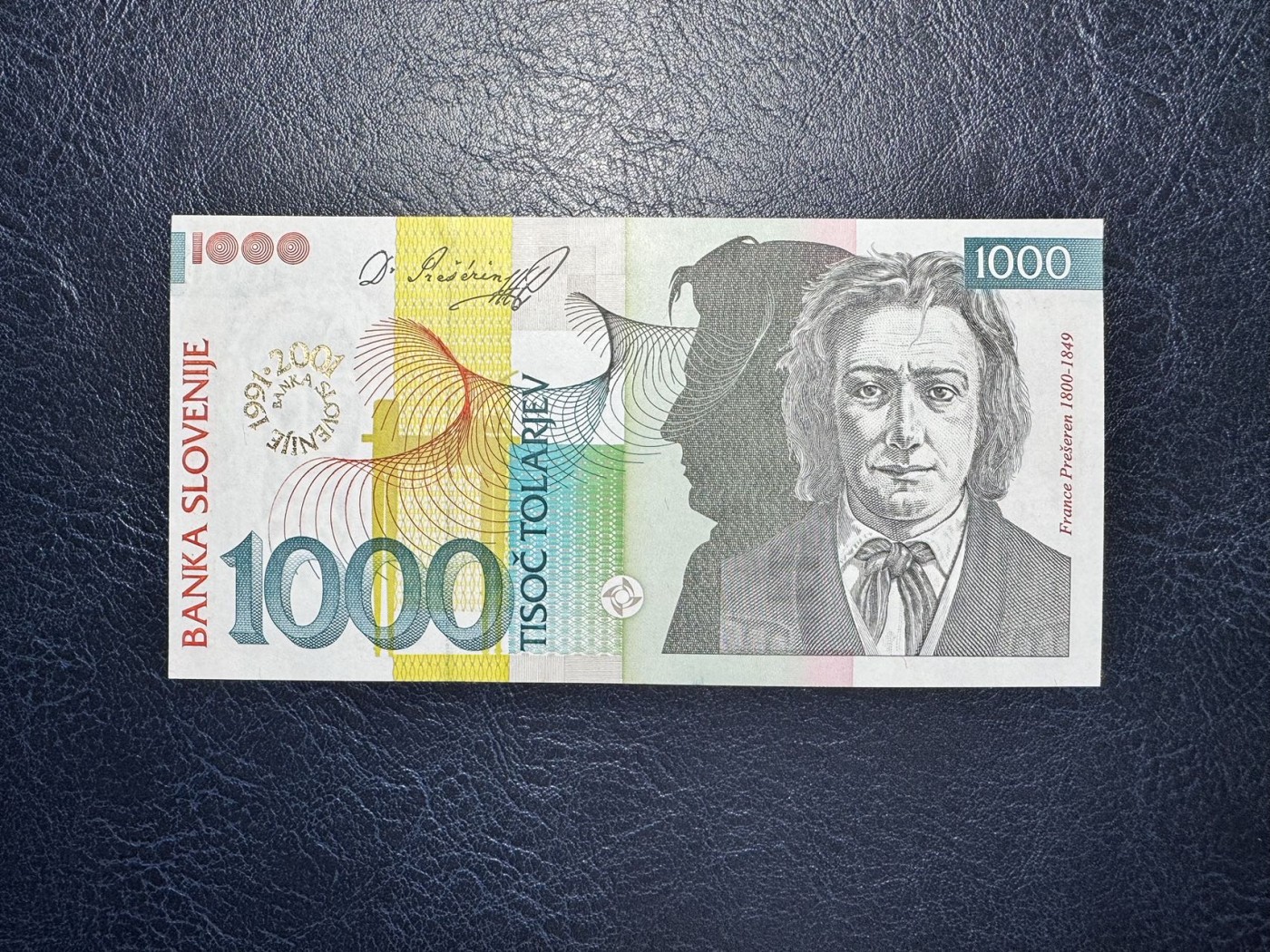 收藏联盟Quantum Auction 第332期拍卖  斯洛文尼亚2001年1000托拉尔银行成立10周年纪念钞 品相UNC 角尖有原始印刷瑕疵 千位号 朦胧号