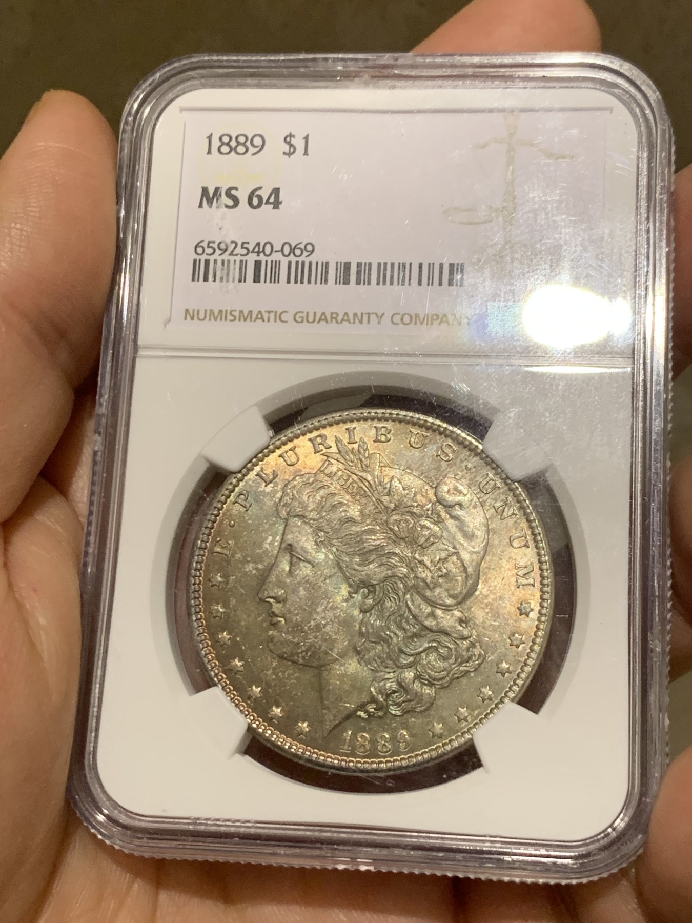 《竞宝斋》第251场-周日，周一2场连拍 (全场包邮) NGC MS64 美国1889年摩根银币P版，少见年份。