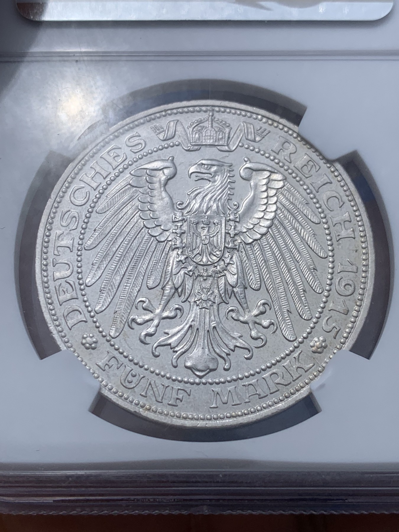 《竞宝斋》第251场-周日，周一2场连拍 (全场包邮) NGC PF65 德国梅克伦堡-什末林大公国 1915年精制币5马克 高端马克品种，铸造量1万枚（包含了普制和精制），底板完美，价值低估品种，收藏级