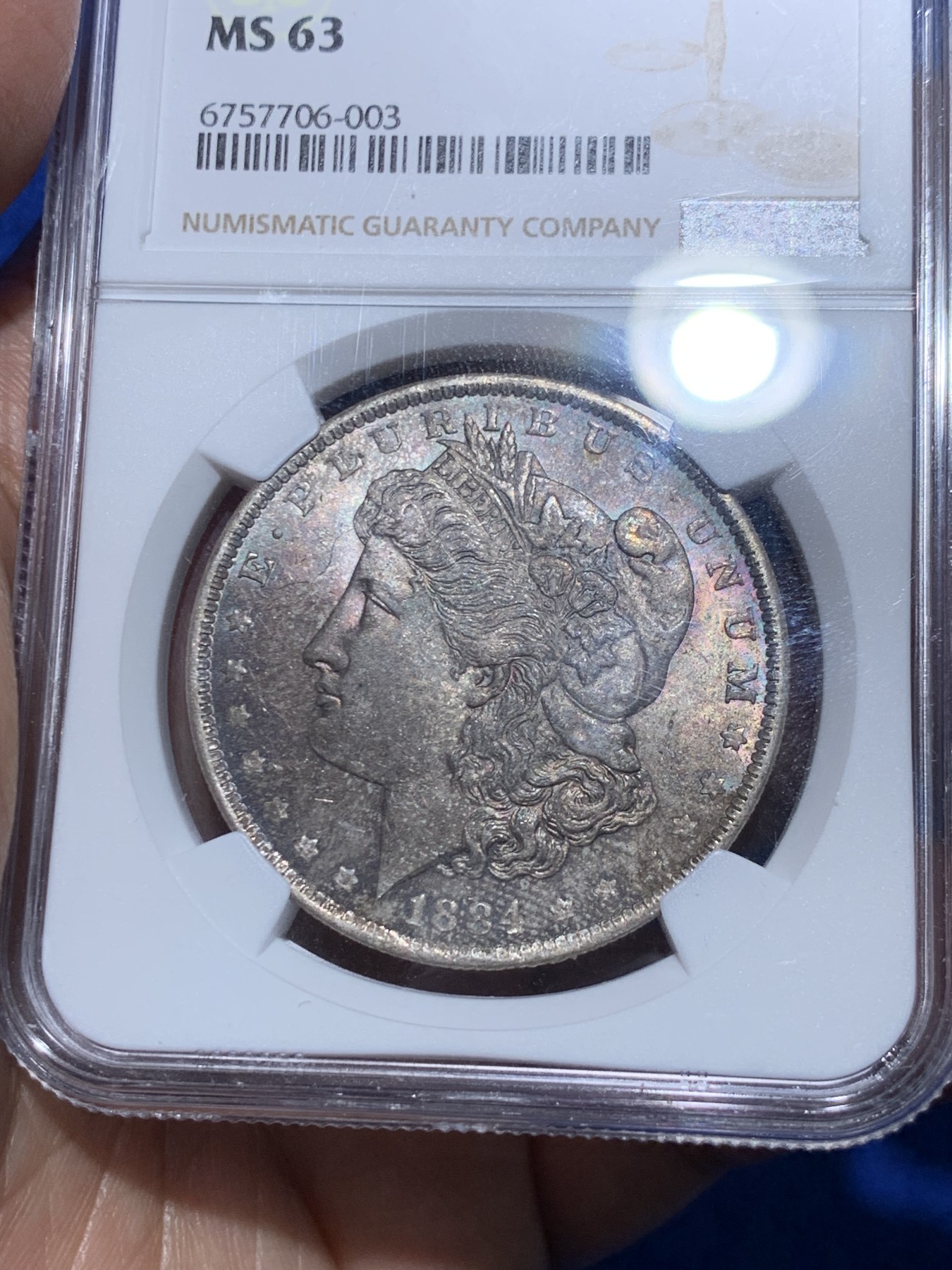《竞宝斋》第252场-周日，周一2场连拍 (全场包邮) NGC MS63 美国1884年摩根银币O版，双面五彩。