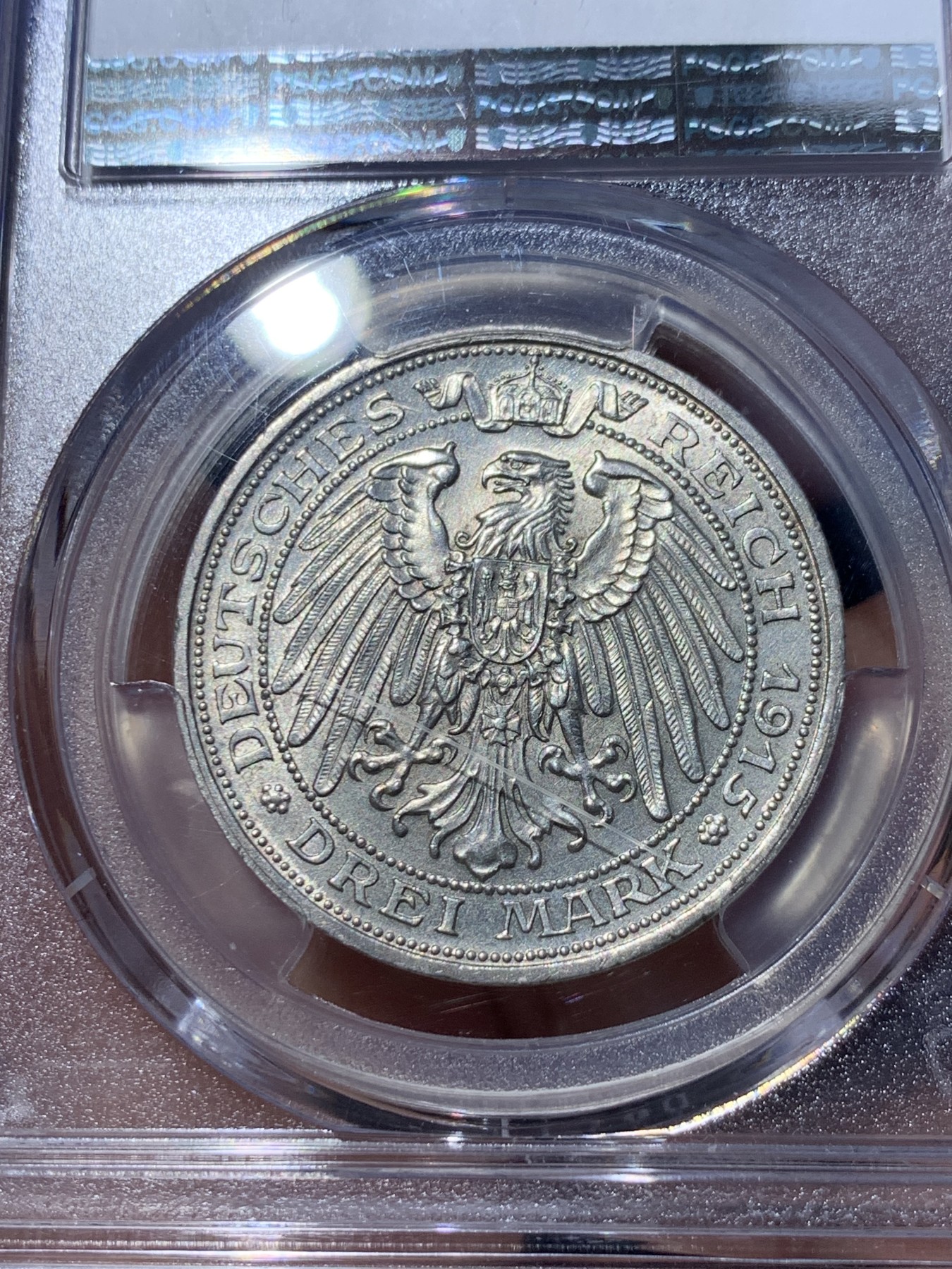 《竞宝斋》第252场-周日，周一2场连拍 (全场包邮) PCGS MS64 德国普鲁士1915曼斯菲尔德屠龙3马克银币 背面盒子上有一划痕