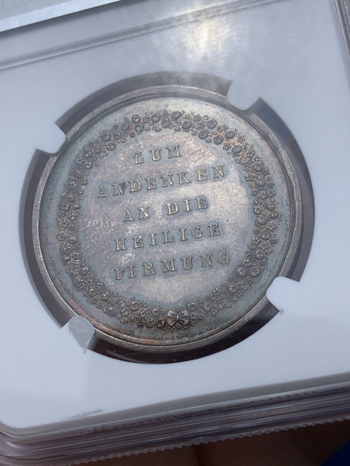《竞宝斋》第252场-周日，周一2场连拍 (全场包邮) NGC MS61 19世纪德国宗教洗礼银章 镜面底板 五彩包浆 低评好品好状态
