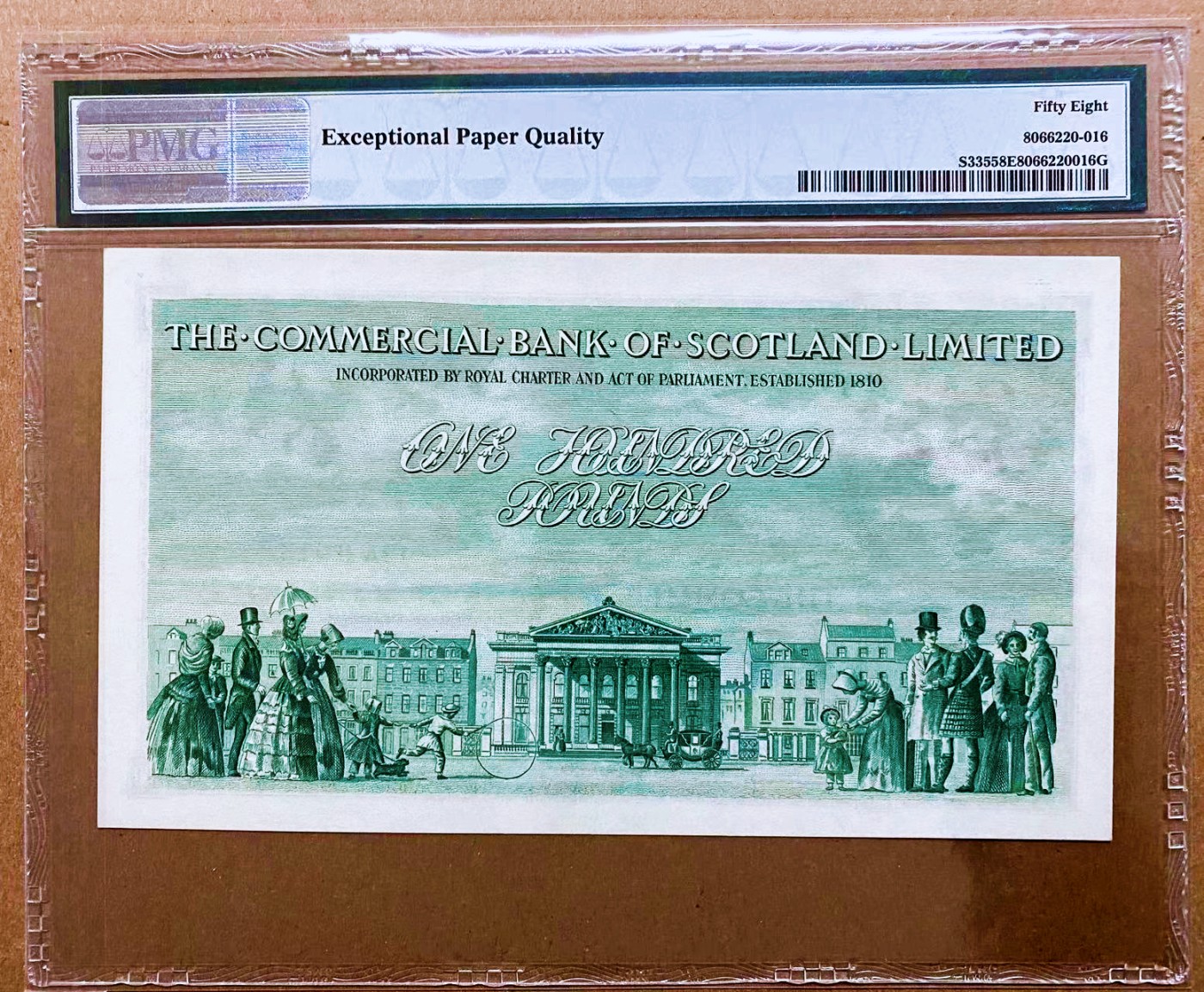 【Blue Auction】✨世界纸币精拍第450期——英伦三岛专场 【冠军分 仅2张 pS335 大珍】苏格兰商业银行1951年100镑 PMG58EPQ 原票 背面大场景 BWC雕刻精美  该日期仅发行3000张 当时为了适应苏格兰当地银行的柜台大小，员工往往会在新钞发行前折一到两次放入抽屉，所以PMG58E已是该版纸币事实意义上的全新品，极为难得 