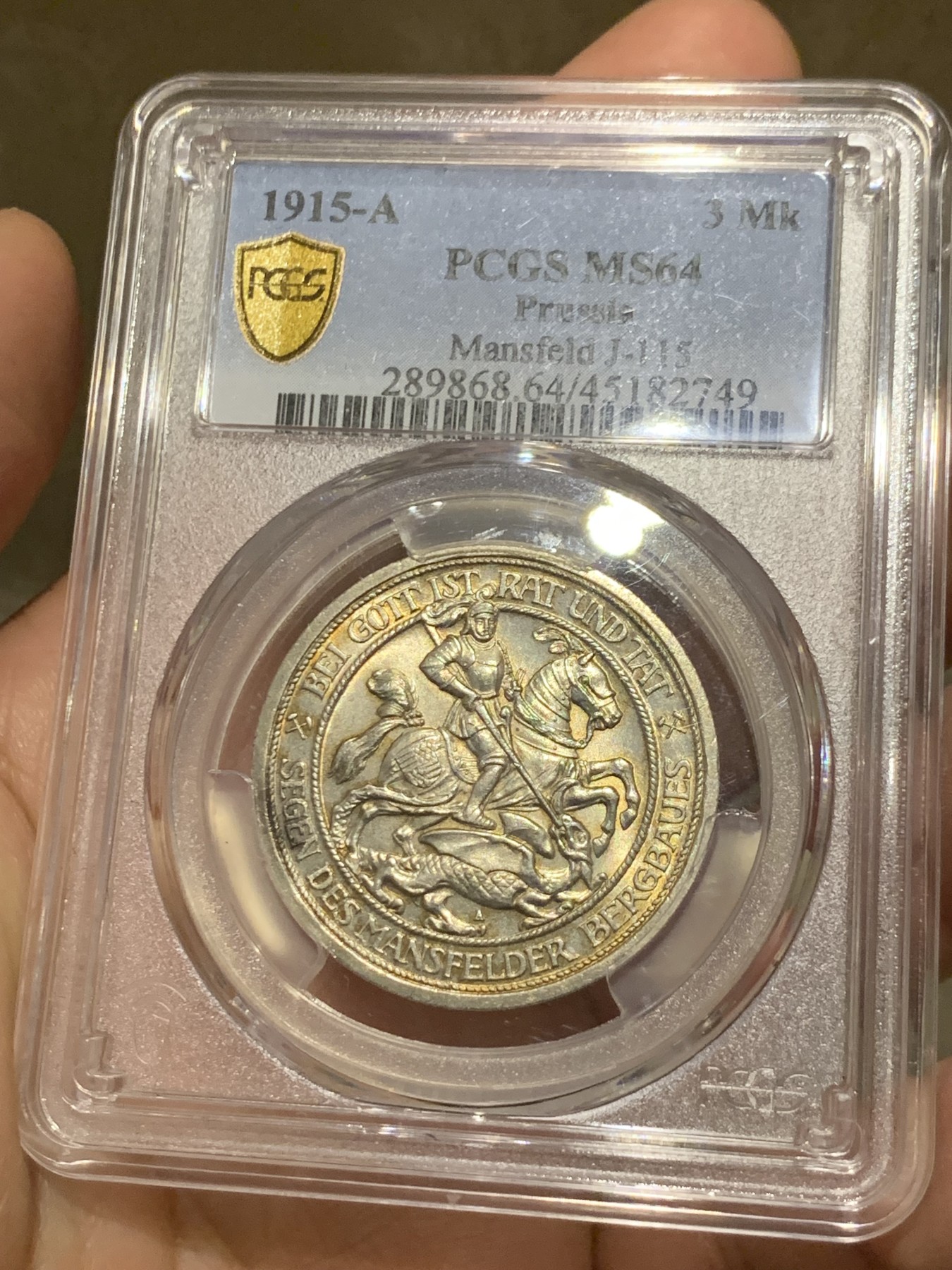 《竞宝斋》第252场-周日，周一2场连拍 (全场包邮) PCGS MS64 德国普鲁士1915曼斯菲尔德屠龙3马克银币 背面盒子上有一划痕