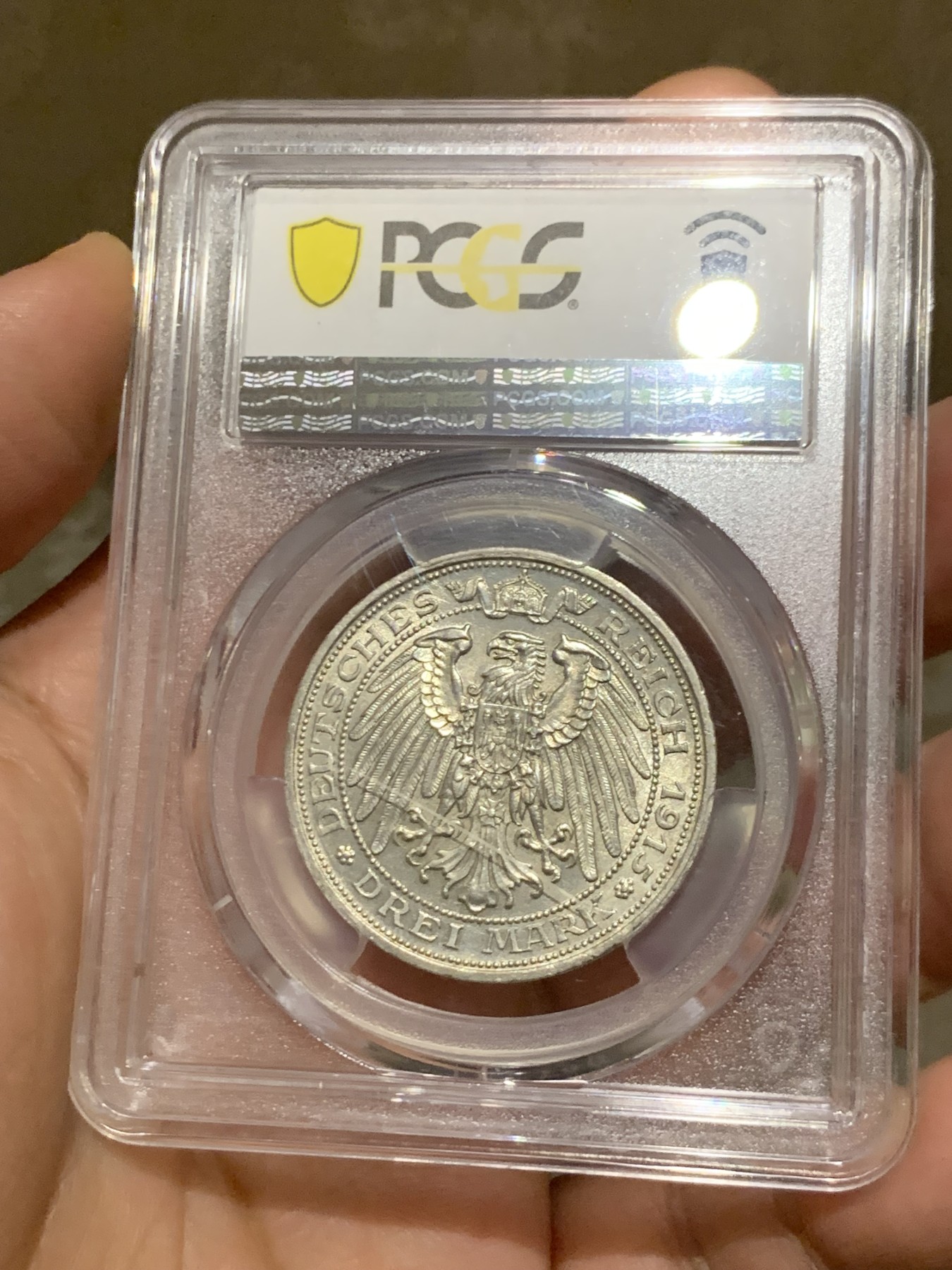 《竞宝斋》第252场-周日，周一2场连拍 (全场包邮) PCGS MS64 德国普鲁士1915曼斯菲尔德屠龙3马克银币 背面盒子上有一划痕