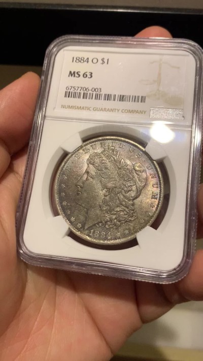 《竞宝斋》第252场-周日，周一2场连拍 (全场包邮) NGC MS63 美国1884年摩根银币O版，双面五彩。