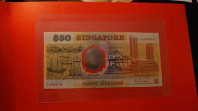 【世界钱币】精选微拍第99期暨2024年第10期  少量新品裸钞和评级币 1990年新加坡50元纪念钞 A冠全新绝品无47尾号613 原装册