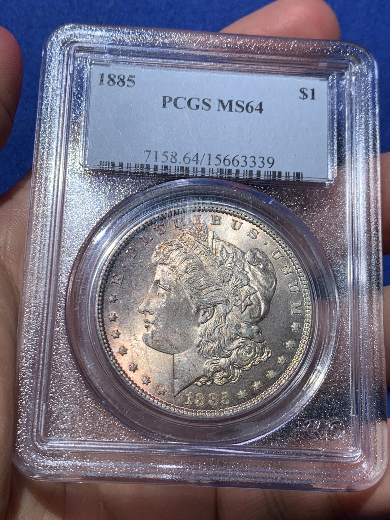 《竞宝斋》第253场-周日，周一，周二 3场连拍 (全场包邮) PCGS MS64 美国1885年摩根银币O版，币面清爽干净又漂亮，打制精美，状态一流，PC经典小白盒严评无官网图。