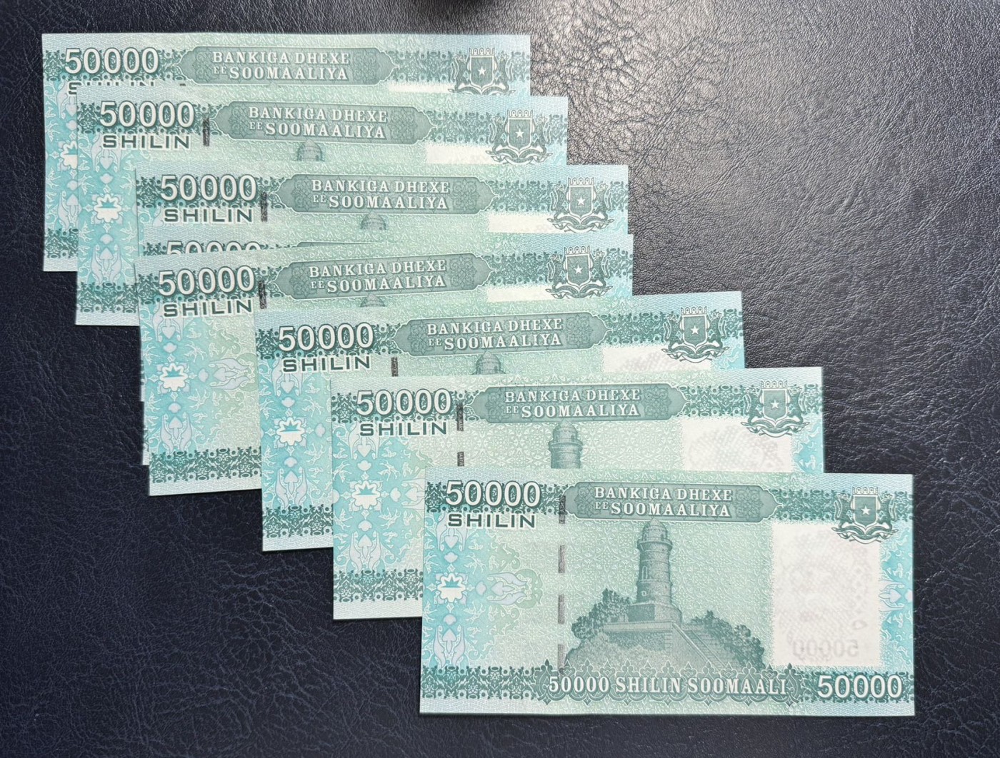 收藏联盟Quantum Auction 第335期拍卖  索马里2010年50000先令未发行版8张 品相全新UNC FA首发冠 因战乱而未发行