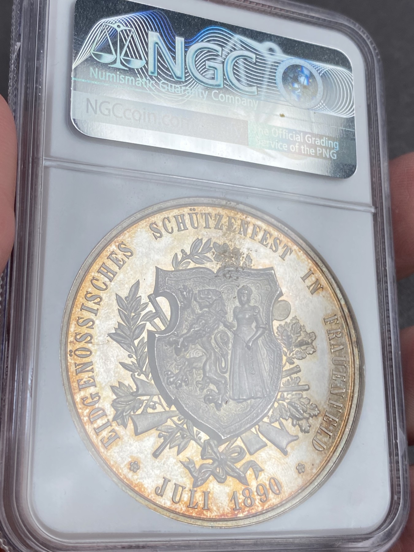 万国钱币拍卖第023期（金辉银韵之夜） NGC MS64PL 1890瑞士图尔高射击节大银章 完美的镜面，完美的包浆，一切都是那么恰到好处。