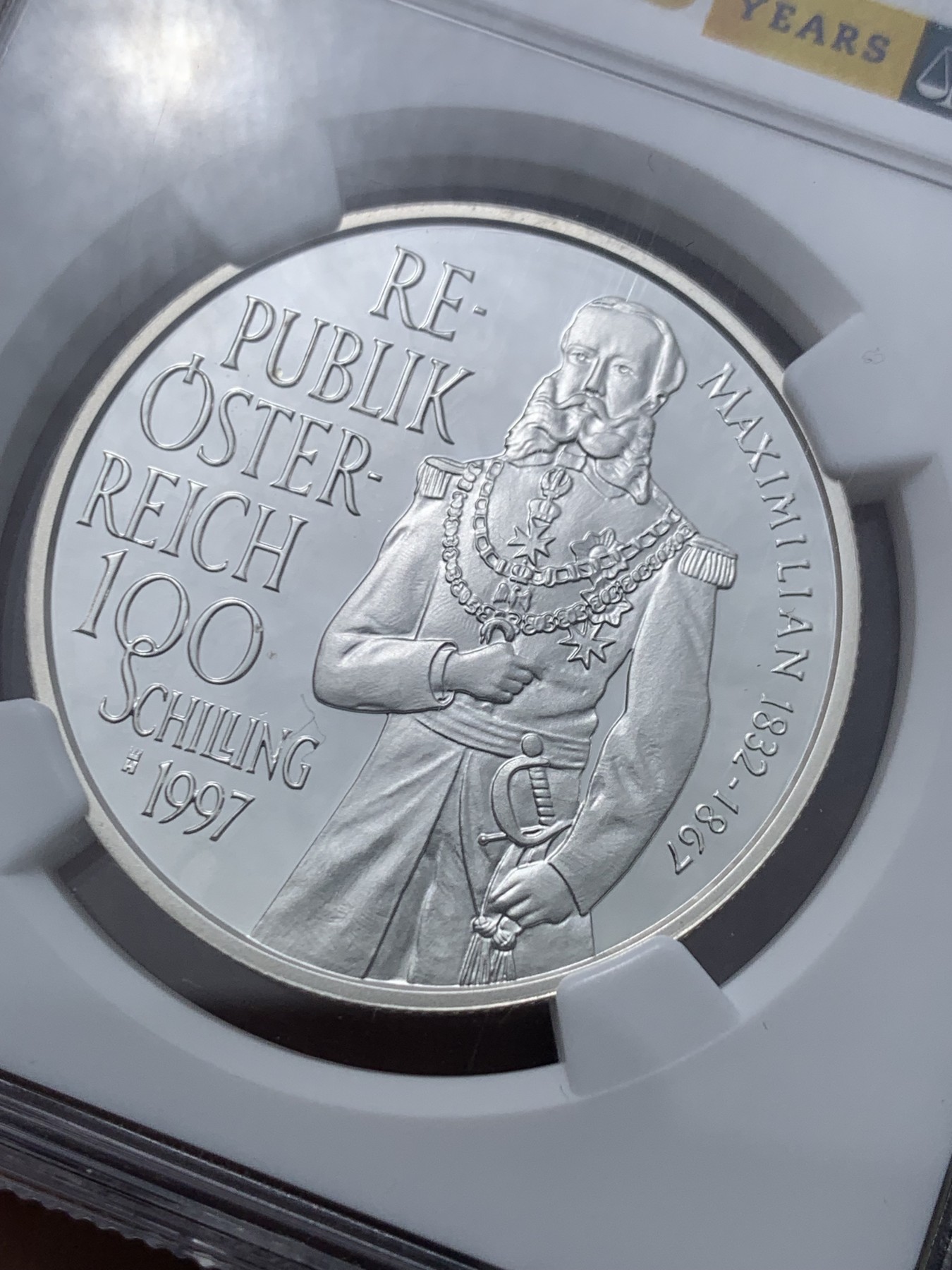 《竞宝斋》第257场-周日，周一 2场连拍 (全场包邮) NGC PF69UC 奥地利1997年发行马克西米利皇帝100先令精制币（克劳斯获奖1999年最佳银币） NGC35周年标 盒装