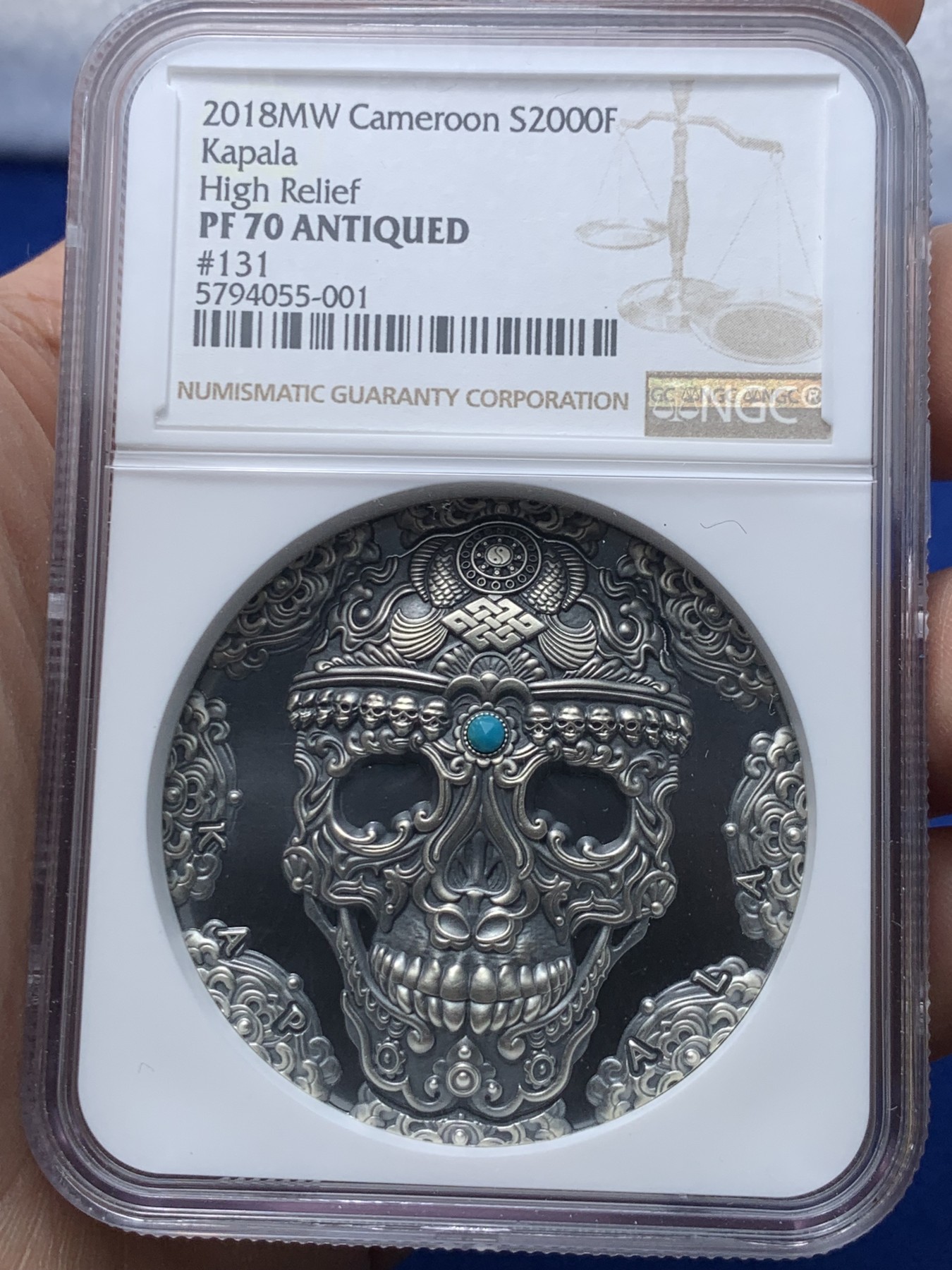 《竞宝斋》第257场-周日，周一 2场连拍 (全场包邮) NGC PF70 喀麦隆2018卡帕拉头盖镶嵌绿松石 2盎司 银币 131 盒证齐全 镶嵌工艺 世界文化系列首枚