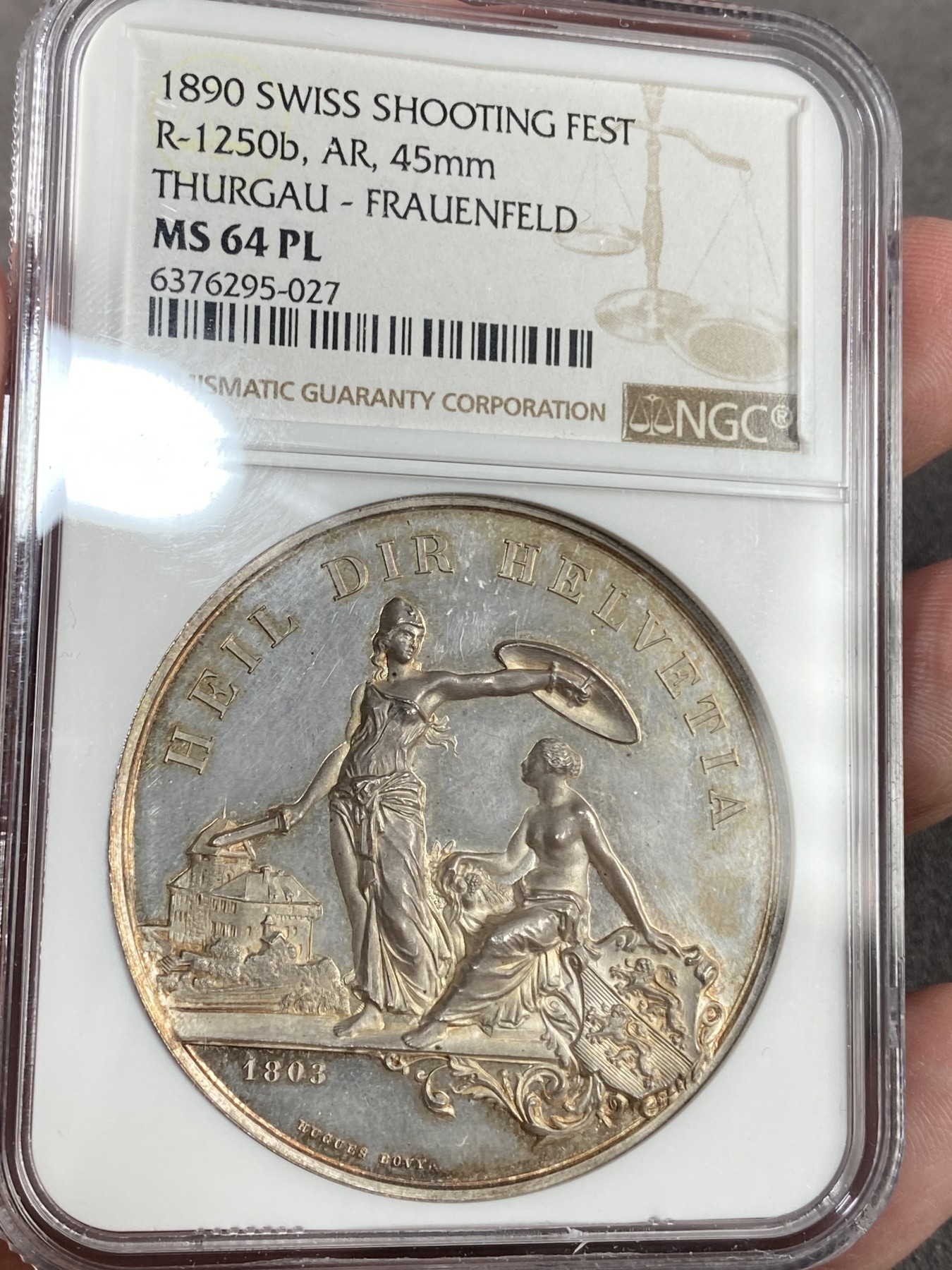 万国钱币拍卖第023期（金辉银韵之夜） NGC MS64PL 1890瑞士图尔高射击节大银章 完美的镜面，完美的包浆，一切都是那么恰到好处。