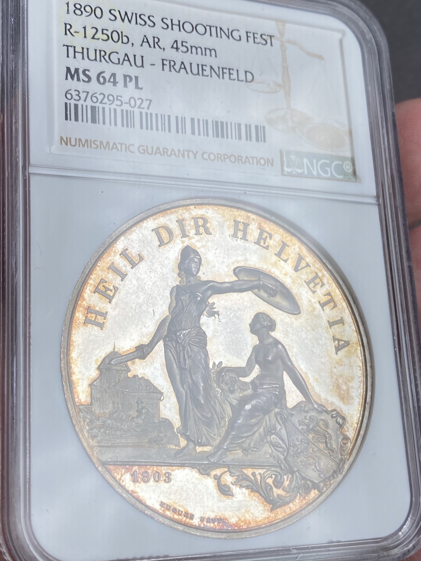 万国钱币拍卖第023期（金辉银韵之夜） NGC MS64PL 1890瑞士图尔高射击节大银章 完美的镜面，完美的包浆，一切都是那么恰到好处。